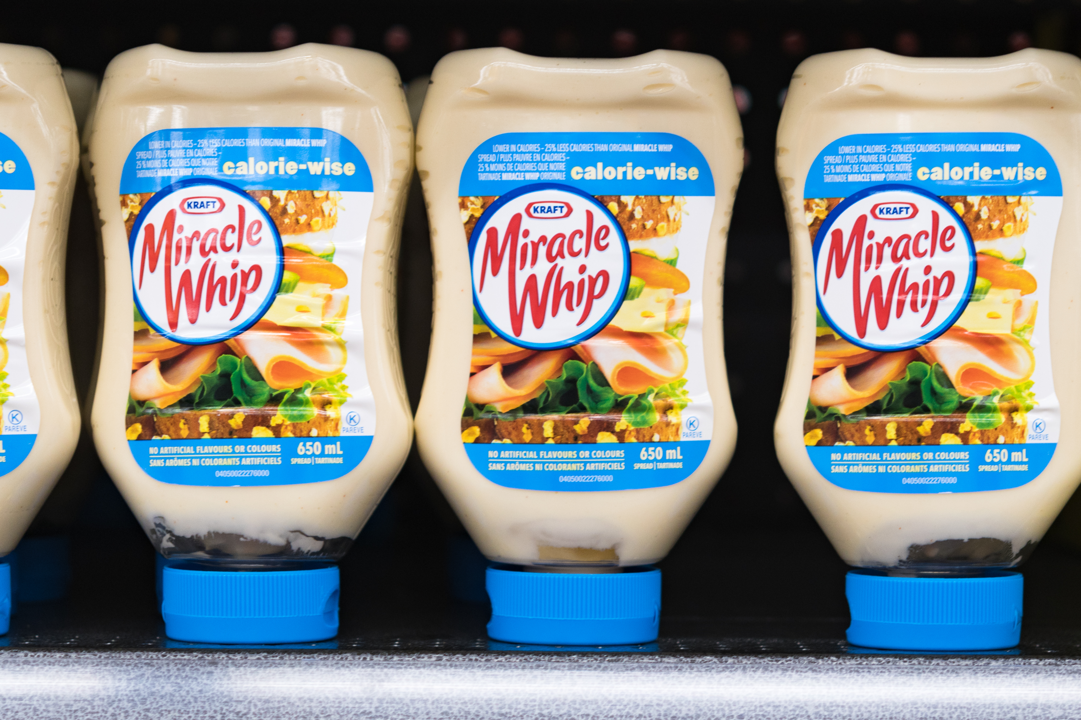 Kraft Miracle Whip on a store shelf, salad dressing bottles