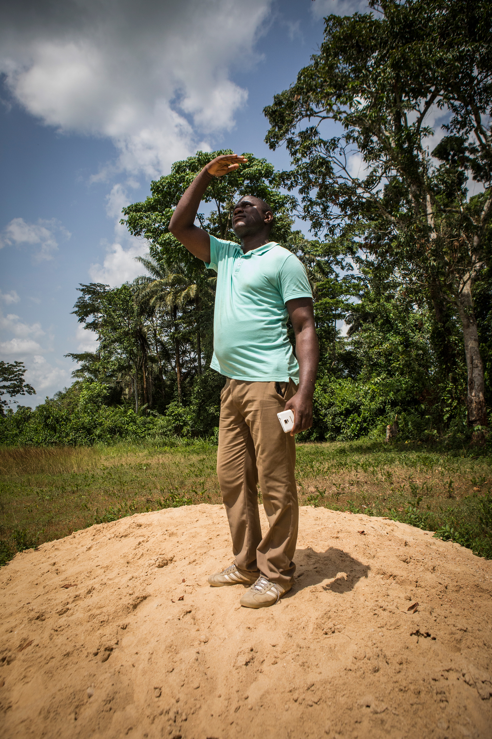Diamond mining team sponsor Pastor Emmanuel Momoh, who took the diamond to a government representative knowing he would be losing the lion’s share of the diamond’s value, has no regrets. In May, Momoh stands where a new school in Koryardu will be built with money from the diamond’s sale. (Jane Hahn for TIME)