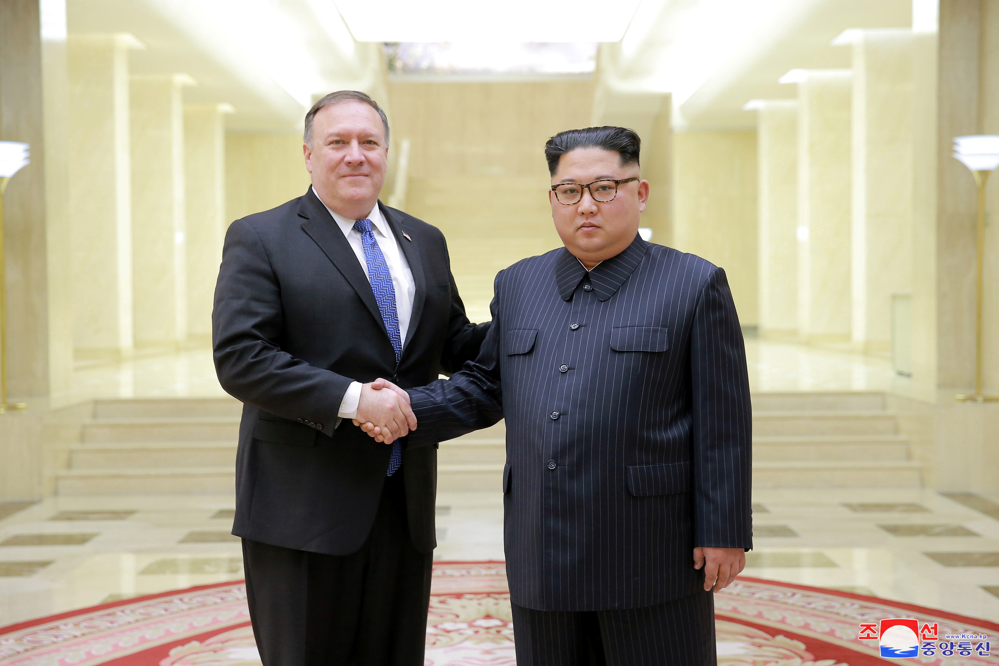 North Korean leader Kim Jong Un shakes hands with U.S. Secretary of State Mike Pompeo
