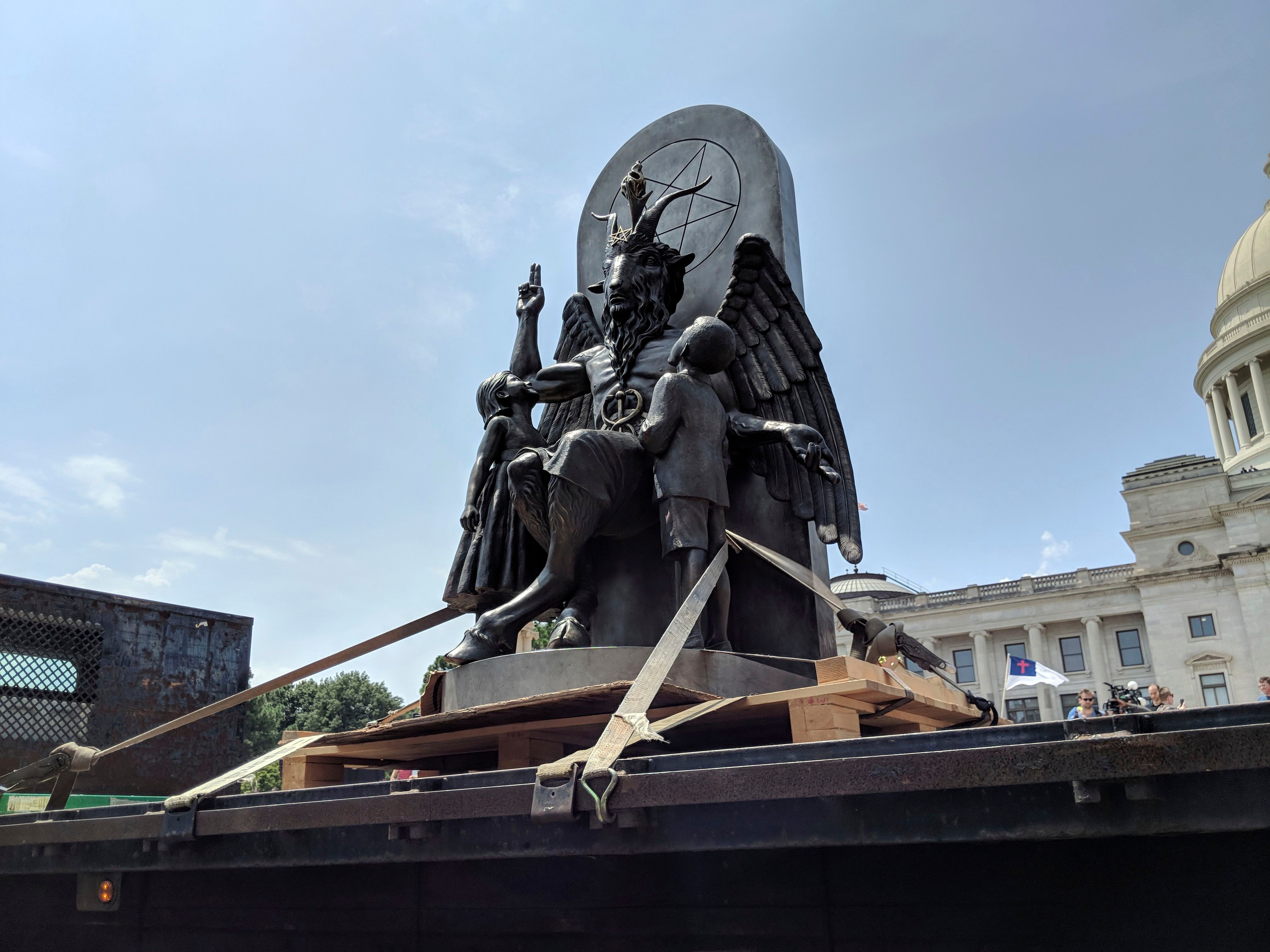 The Satanic Temple unveils its statue of Baphomet, a winged-goat creature, at a rally for the first amendment in Little Rock, Ark. on Aug. 16, 2018. (Hannah Grabenstein/AP/REX/Shutterstock)