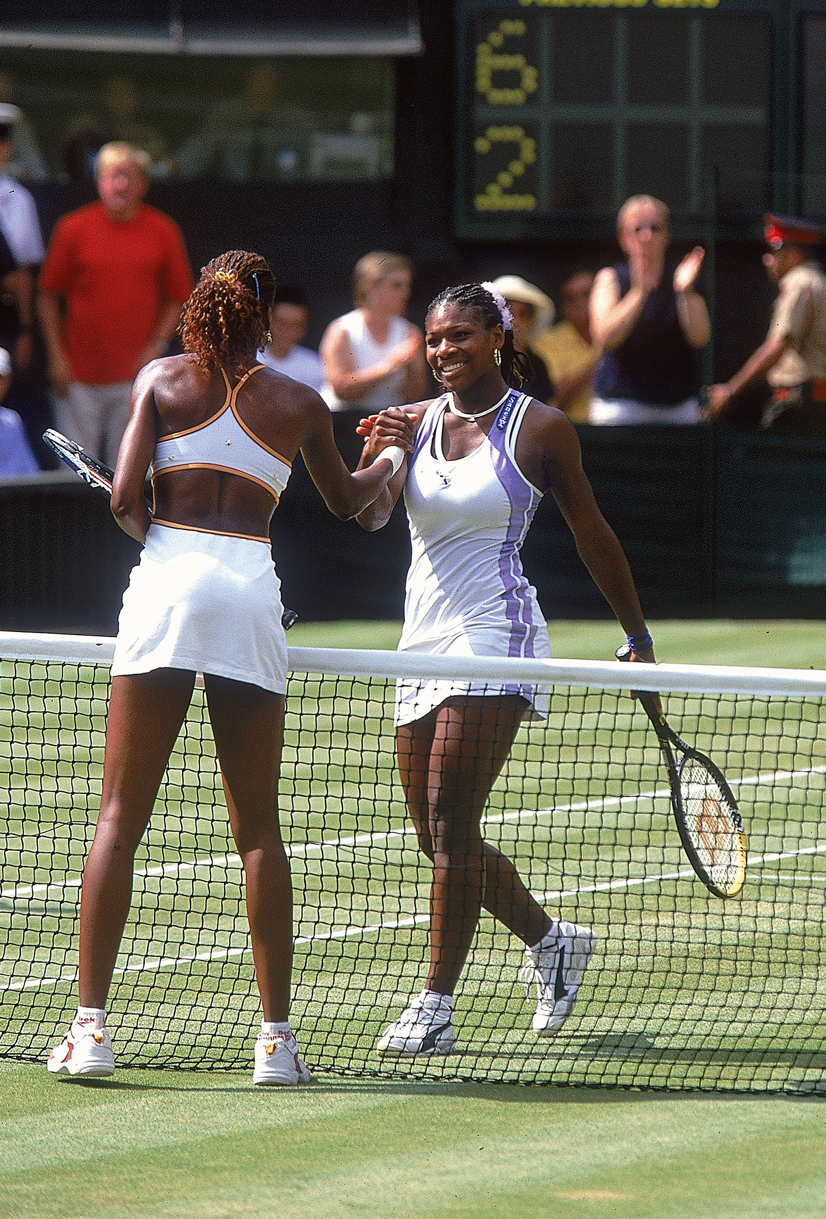Serena Williams of the USA congratulates her sister Venus after losing to her in the womens semi final at the Wimbledon Lawn Tennis Championship at the All England Lawn Tennis and Croquet Club, Wimbledon, London on Jul 6, 2000. (Gary M. Prior—Getty Images)