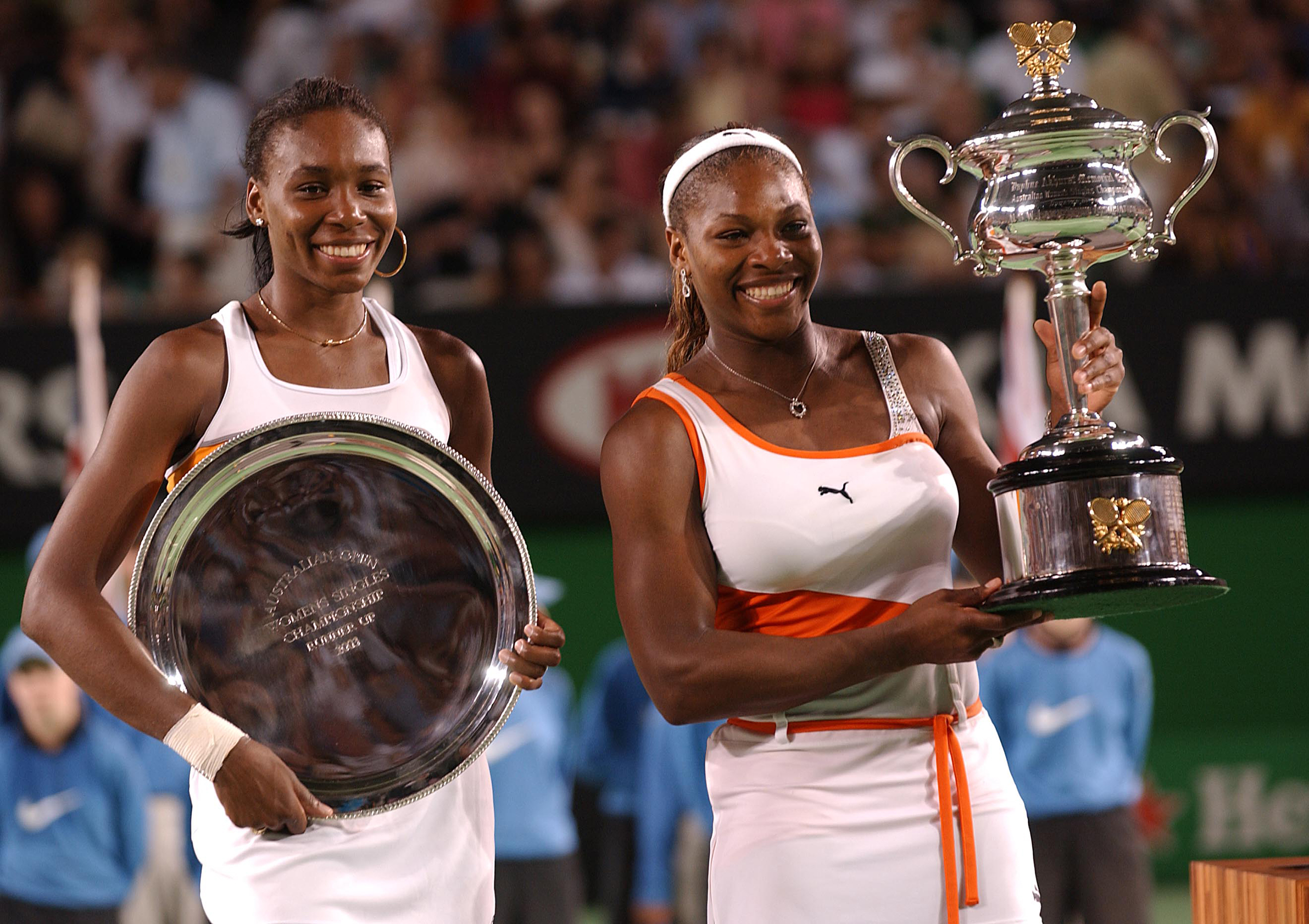 Serena and Venus Williams with their trophys after Serena beat her sister in the Womens Singles Final (Phil Walter - EMPICS—EMPICS Sport)