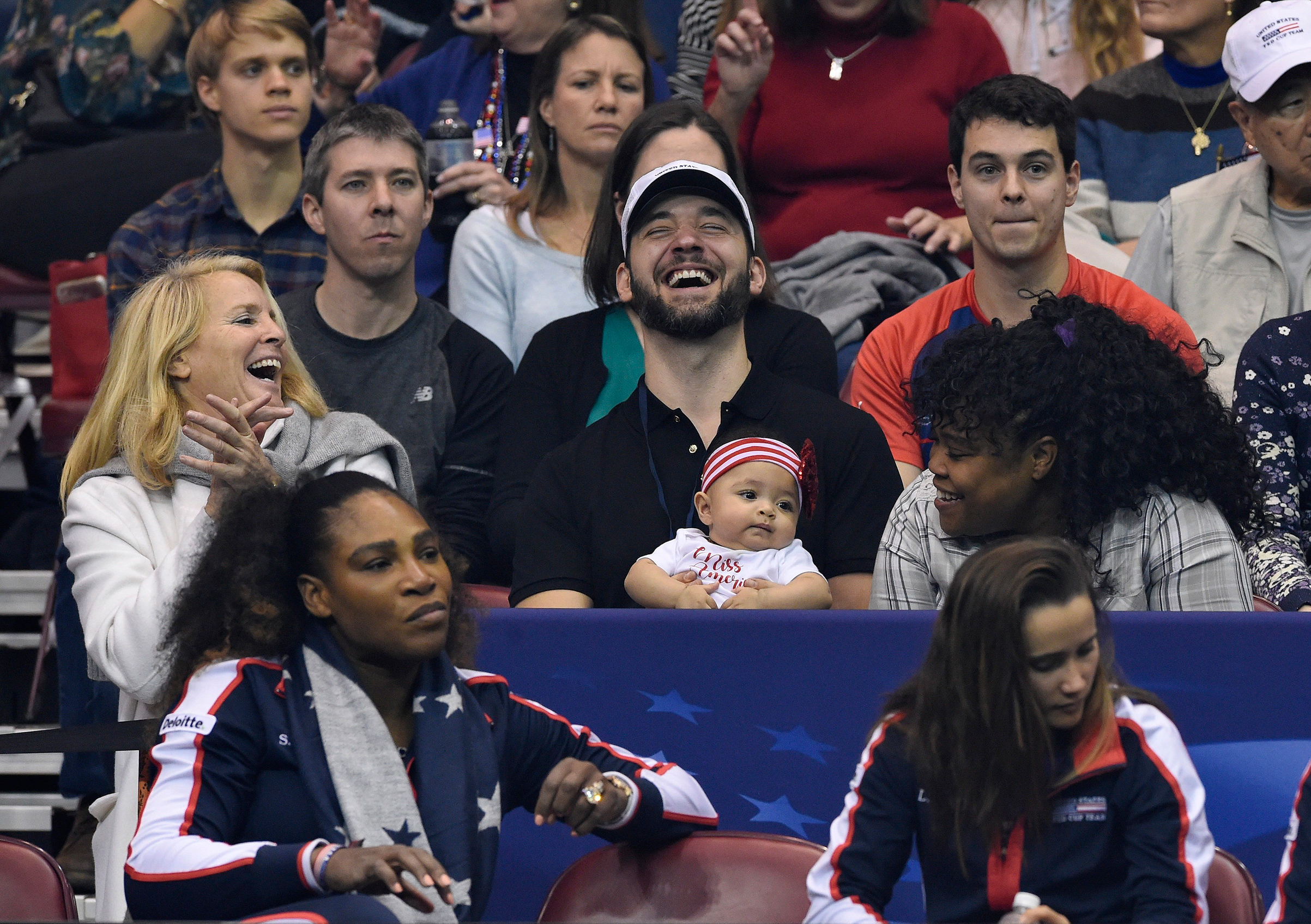 Serena’s husband Ohanian, seen holding Olympia during a Fed Cup match in February, has brought their daughter to most of her mother’s matches since she returned to tennis (Richard Shiro—Getty Images)