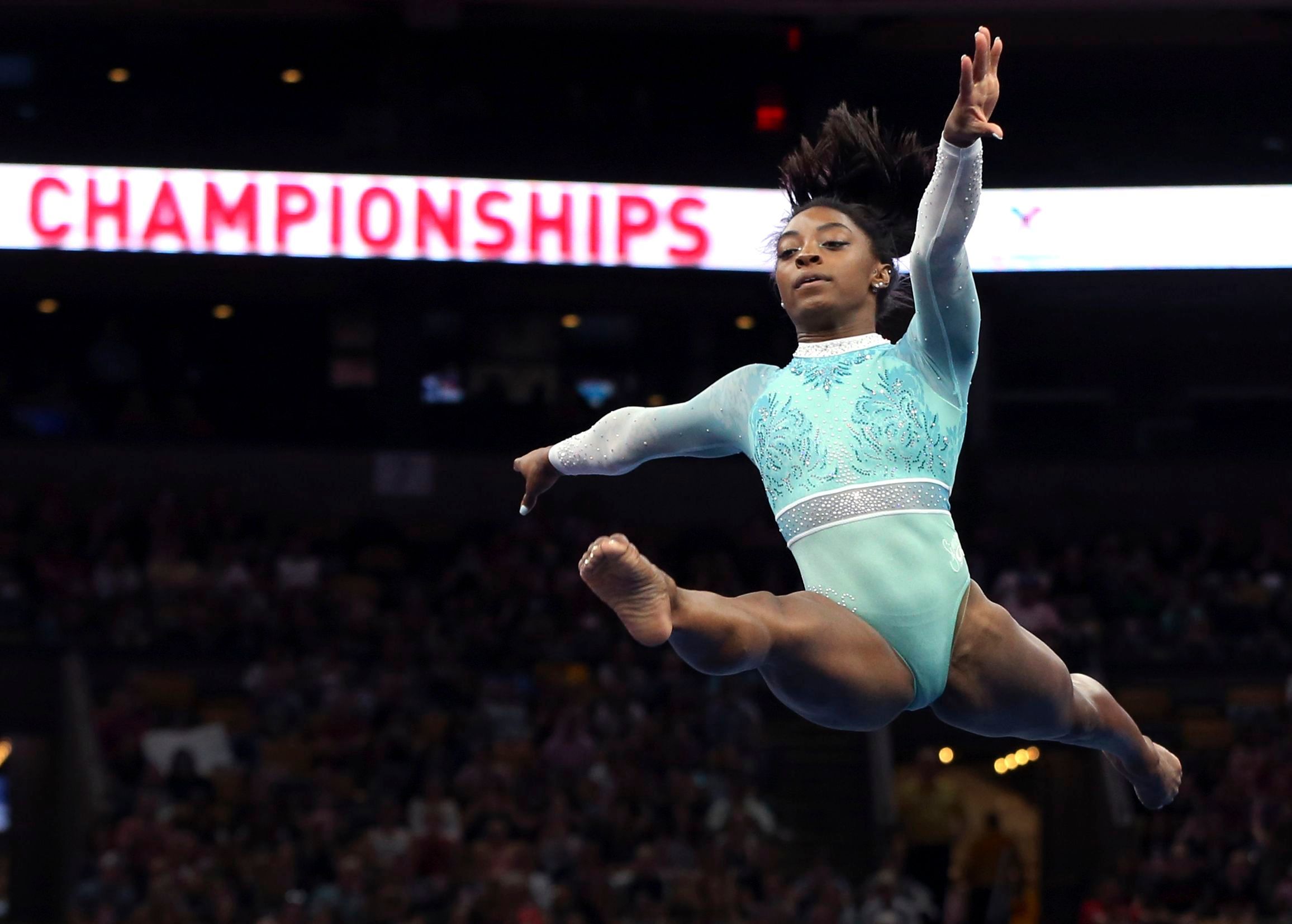 Mandatory Credit: Photo by Elise Amendola/AP/REX/Shutterstock (9794399g)
                      Simone Biles competes on the floor exercise at the U.S. Gymnastics Championships, in Boston
                      US Championships Gymnastics, Boston, USA - 19 Aug 2018 (Elise Amendola/AP/REX/Shutterstock—Elise Amendola/AP/REX/Shutterstock)
