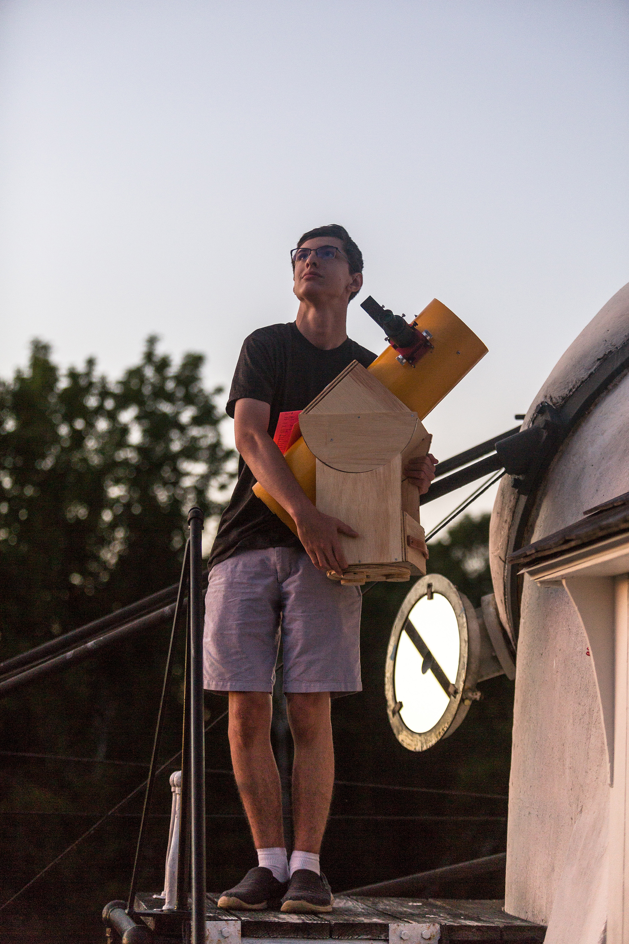 Zane Landers, 15, from Connecticut, with one of his home-made telescopes. (Robert Ormerod for TIME)