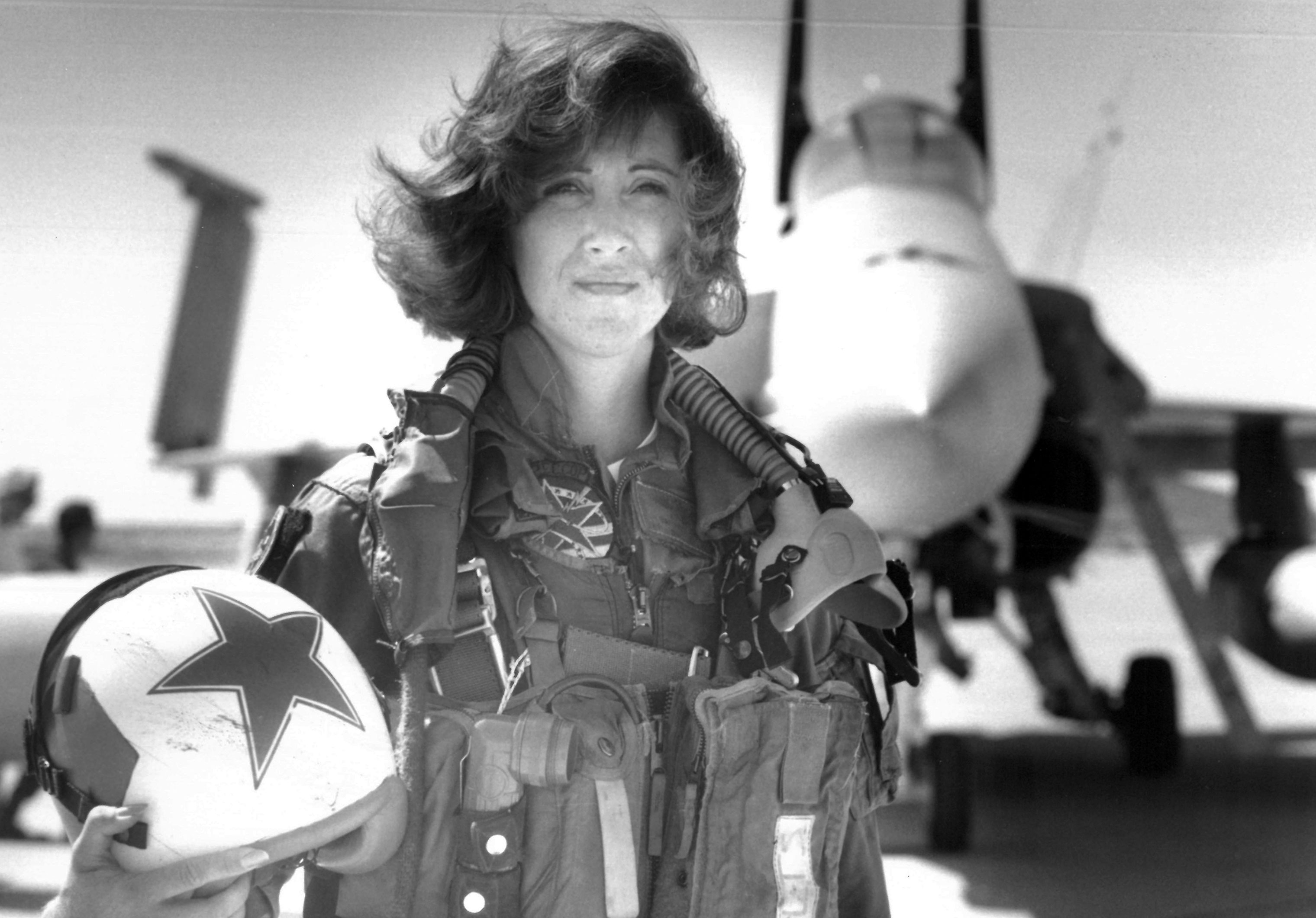 In this image provided by the U.S. Navy, Lt. Tammie Jo Shults, one of the first women to fly Navy tactical aircraft, poses in front of an F/A-18A with Tactical Electronics Warfare Squadron (VAQ) 34 in 1992. After leaving active duty in early 1993, Shults served in the Navy Reserve until 2001. Shults was the pilot of the Southwest plane that made an emergency landing on April 17, 2018, after an engine explosion. (Thomas P. Milne—AP)