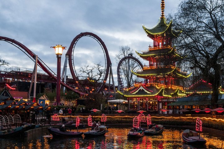A rollercoaster and other rides in the Trivoli Gardens in Copenhagen