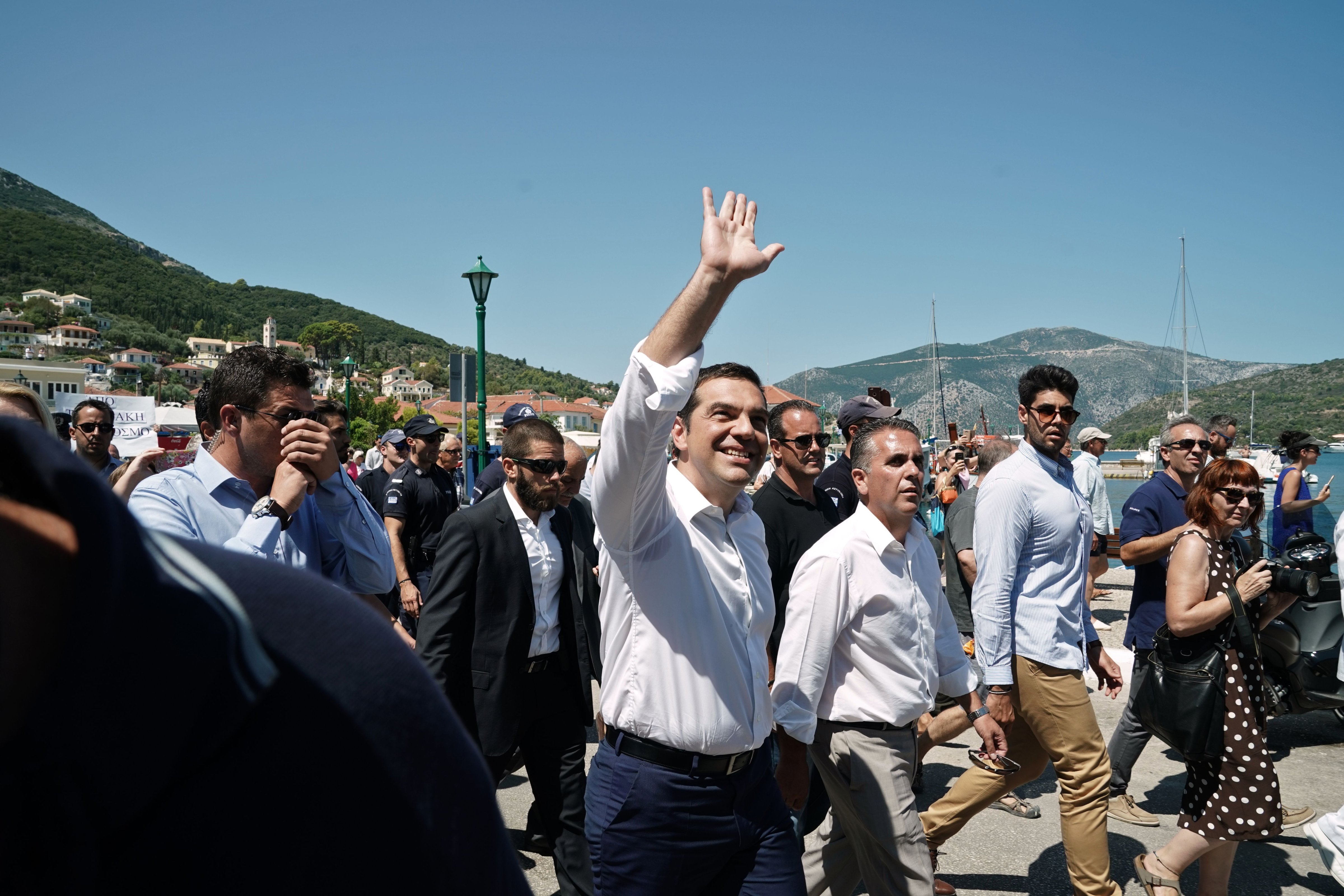 Greek Prime Minister Alexis Tsipras waves at supporters on Ithaca island, on August 21, 2018. (Menelaos Myrillas—AFP/Getty Images)