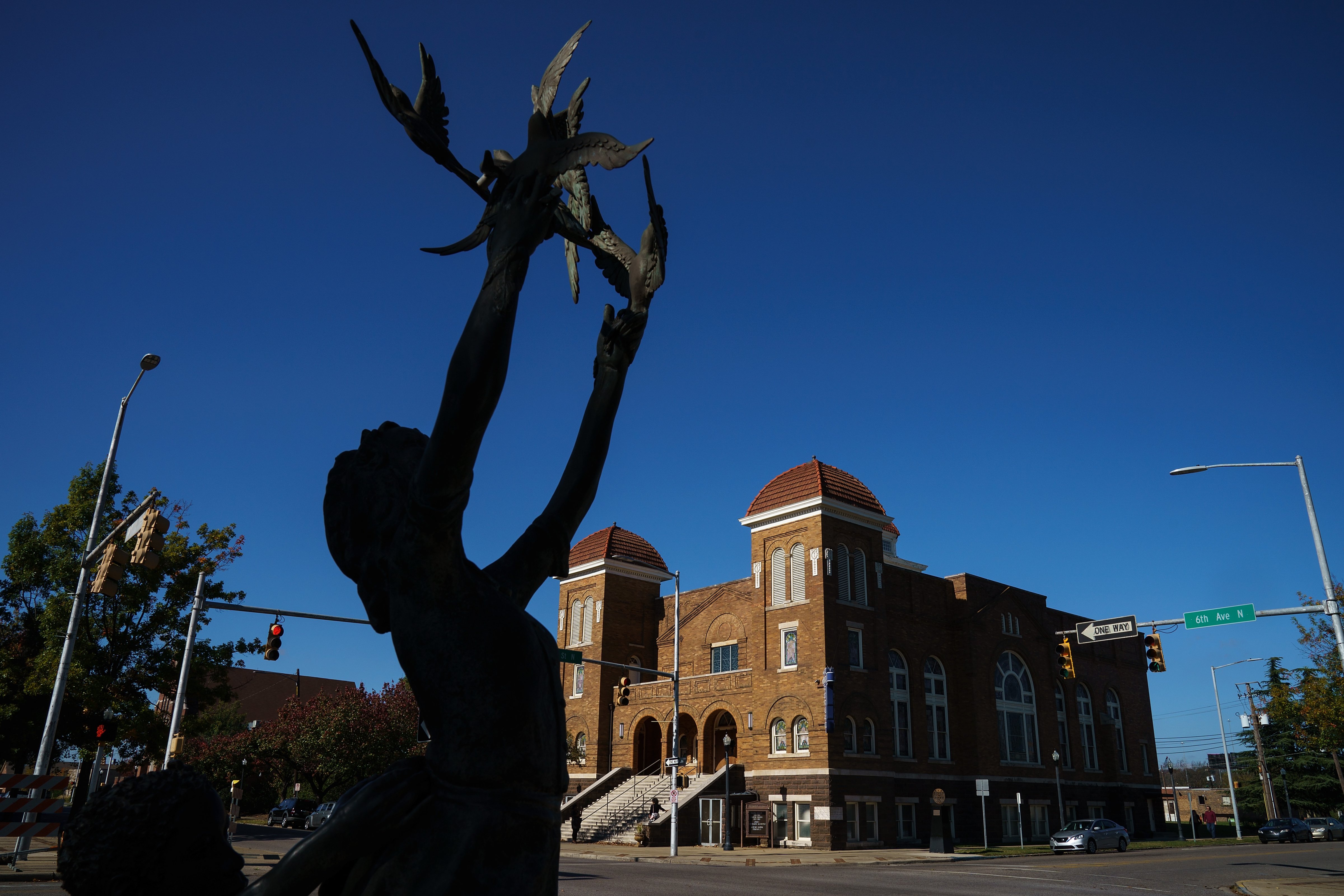 A view of the 'Four Spirits' statue and the 16th Street Baptist Church, Nov. 19, 2017, in Birmingham, Ala.. The statues memorialize the four victims of the 16th Street Baptist Church bombing in 1963. (Drew Angerer—Getty Images)