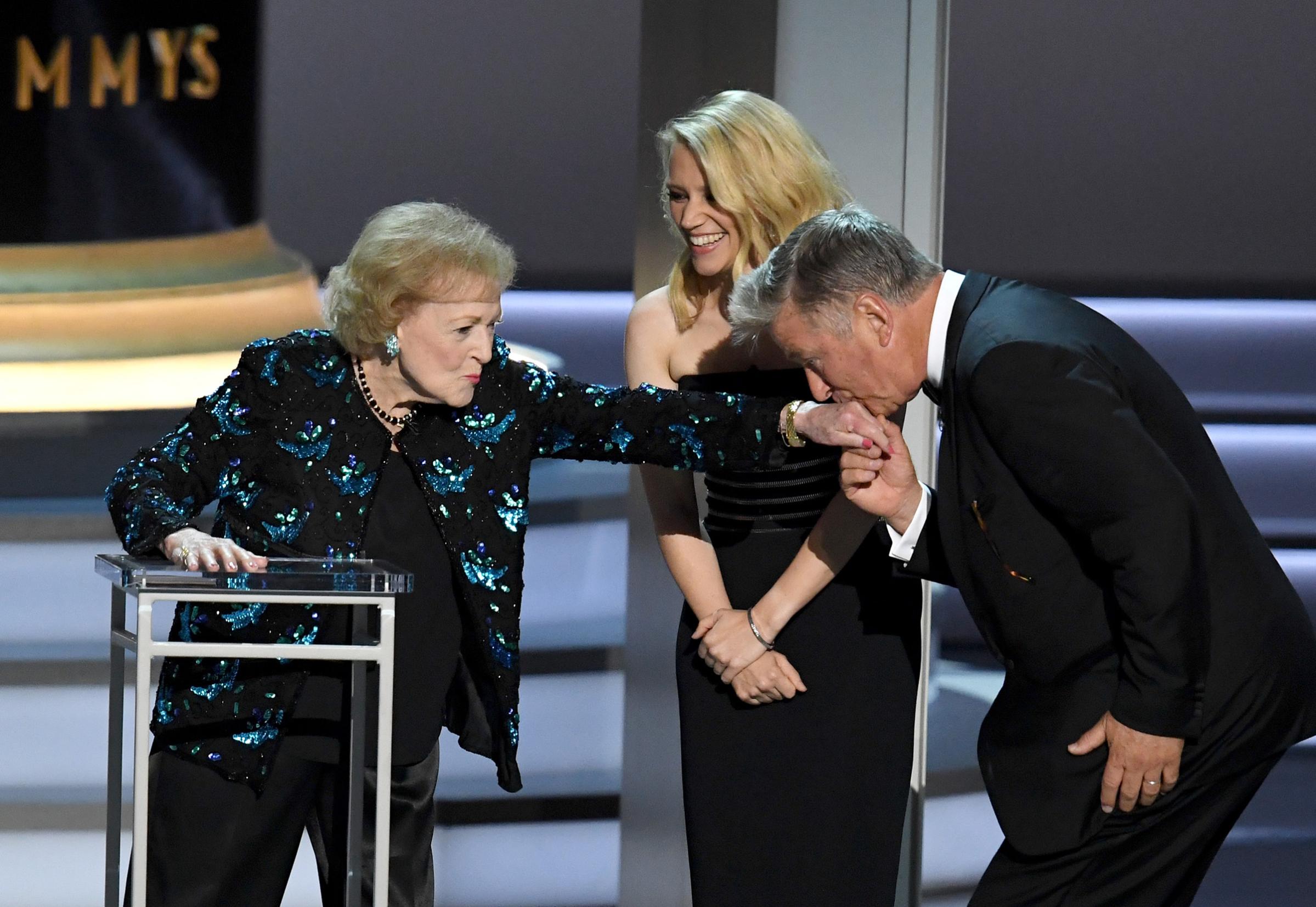 Betty White, Kate McKinnon, and Alec Baldwin speak onstage during the 70th Emmy Awards at Microsoft Theater on Sept. 17, 2018 in Los Angeles.
