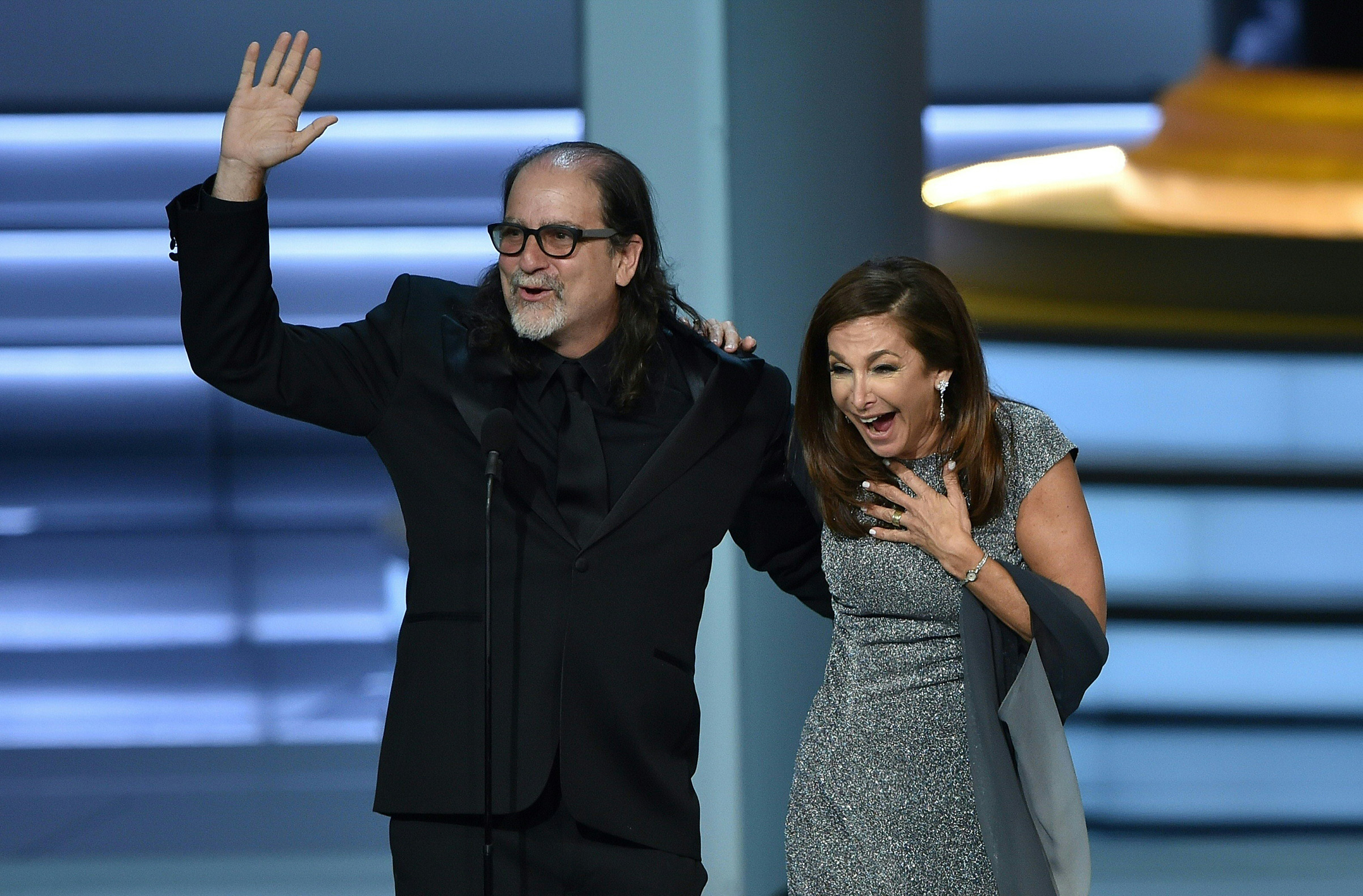 Glenn Weiss, winner of the Outstanding Directing for a Variety Special award for 'The Oscars,' waves to the audience after proposing to Jan Svendsen onstage during the 70th Emmy Awards at the Microsoft Theatre in Los Angeles on Sept. 17, 2018. (Robyn Beck—AFP/Getty Images)