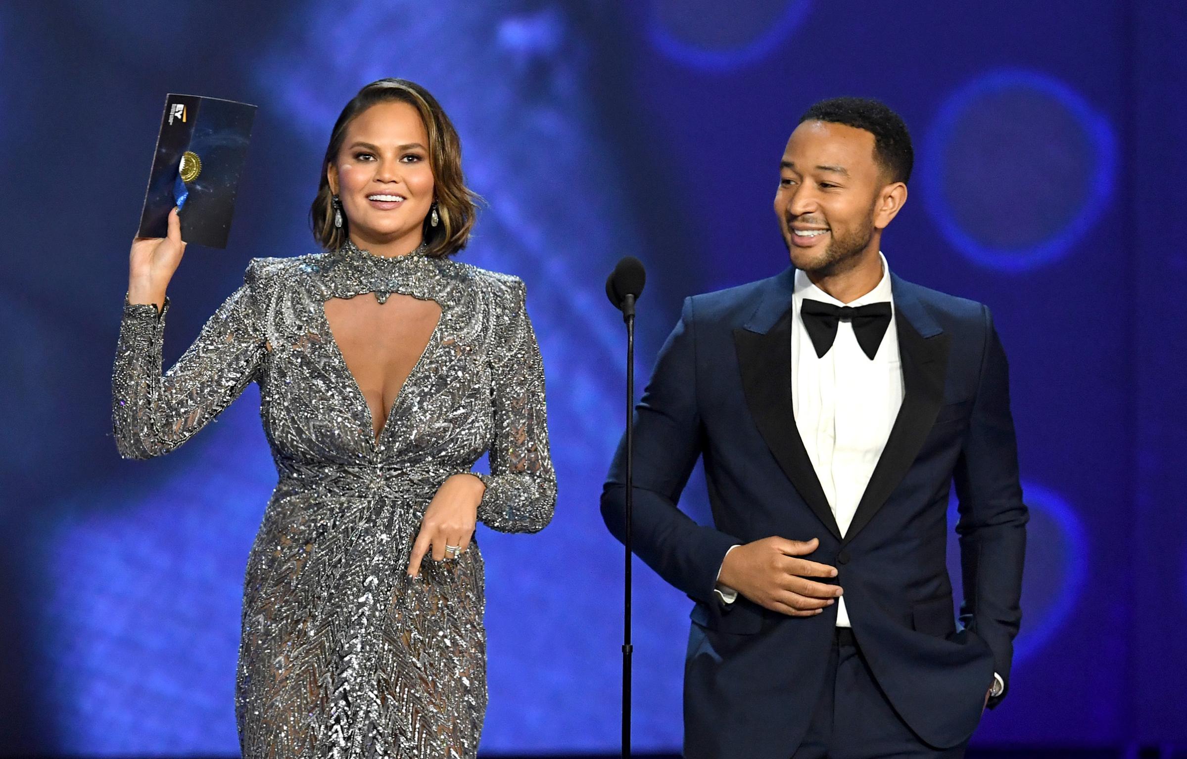Chrissy Teigen and John Legend speak onstage during the 70th Emmy Awards at Microsoft Theater on Sept. 17, 2018 in Los Angeles.