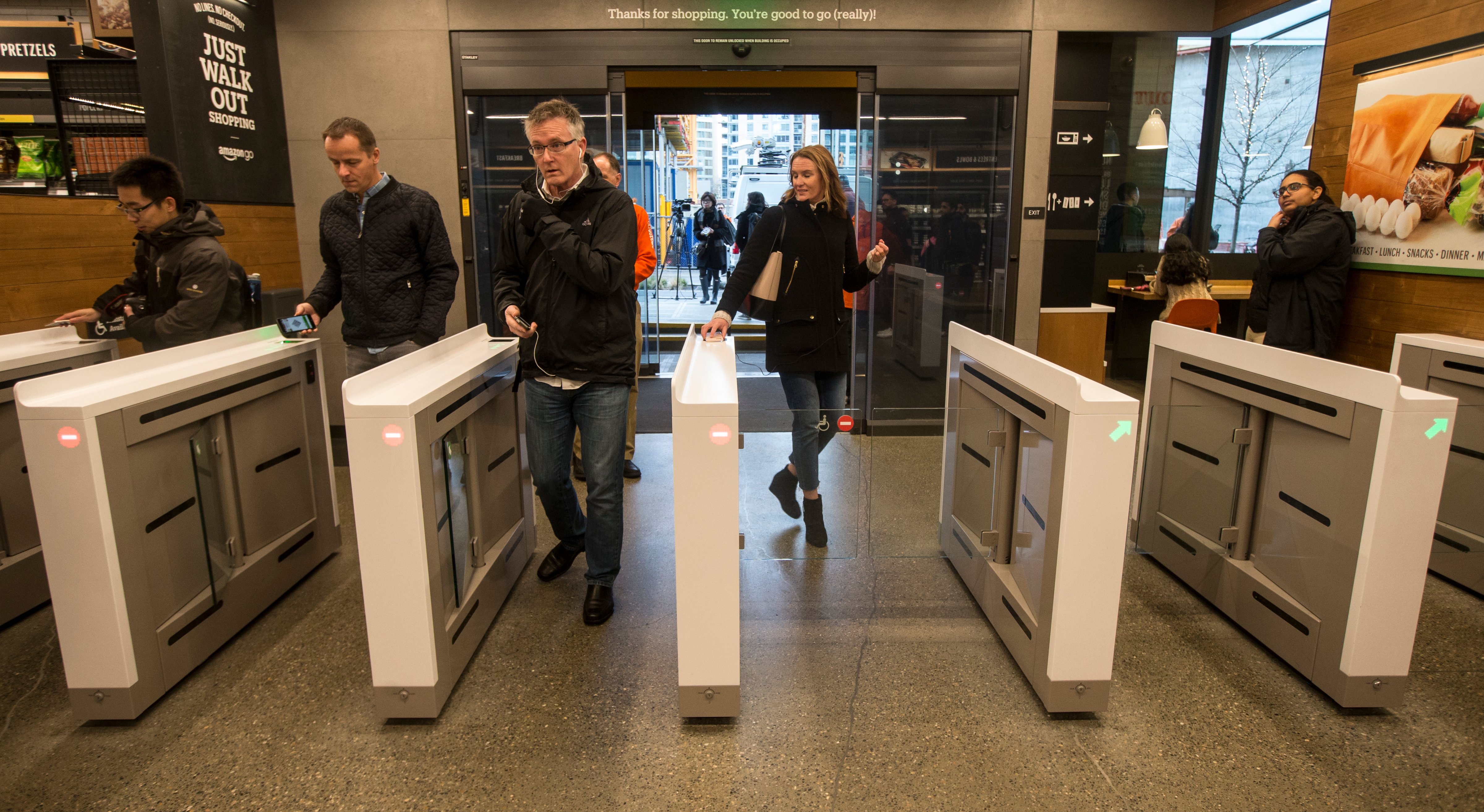 Shoppers scan the Amazon Go app on the mobile devices as the enter the Amazon Go store, on January 22, 2018 in Seattle, Washington. (Stephen Brashear—Getty Images)