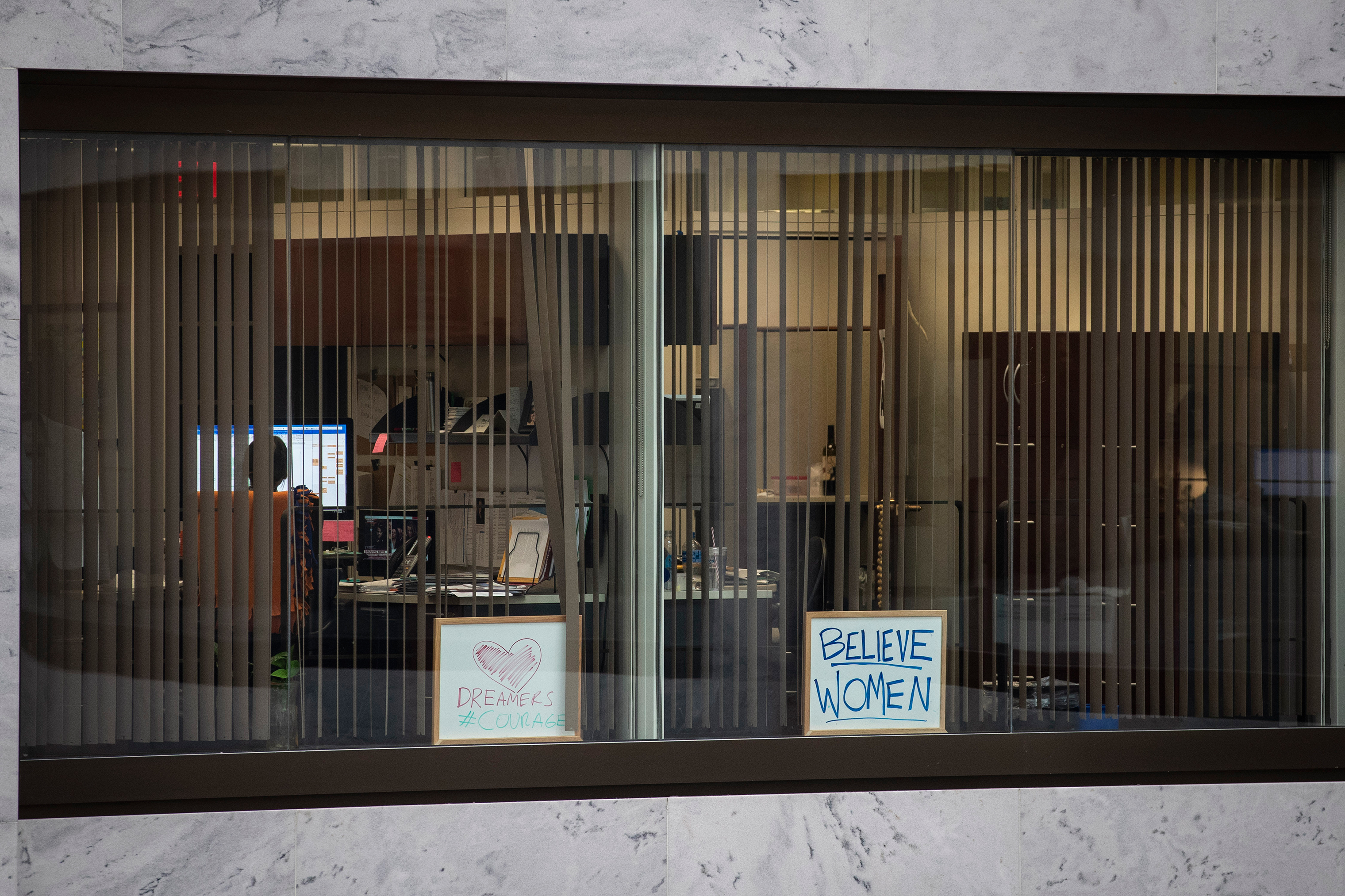 A sign reading 'Believe Women' sits in the window of an office in the Hart Senate Office Building on Capitol Hill on Sept. 27. (Drew Angerer—Getty Images)