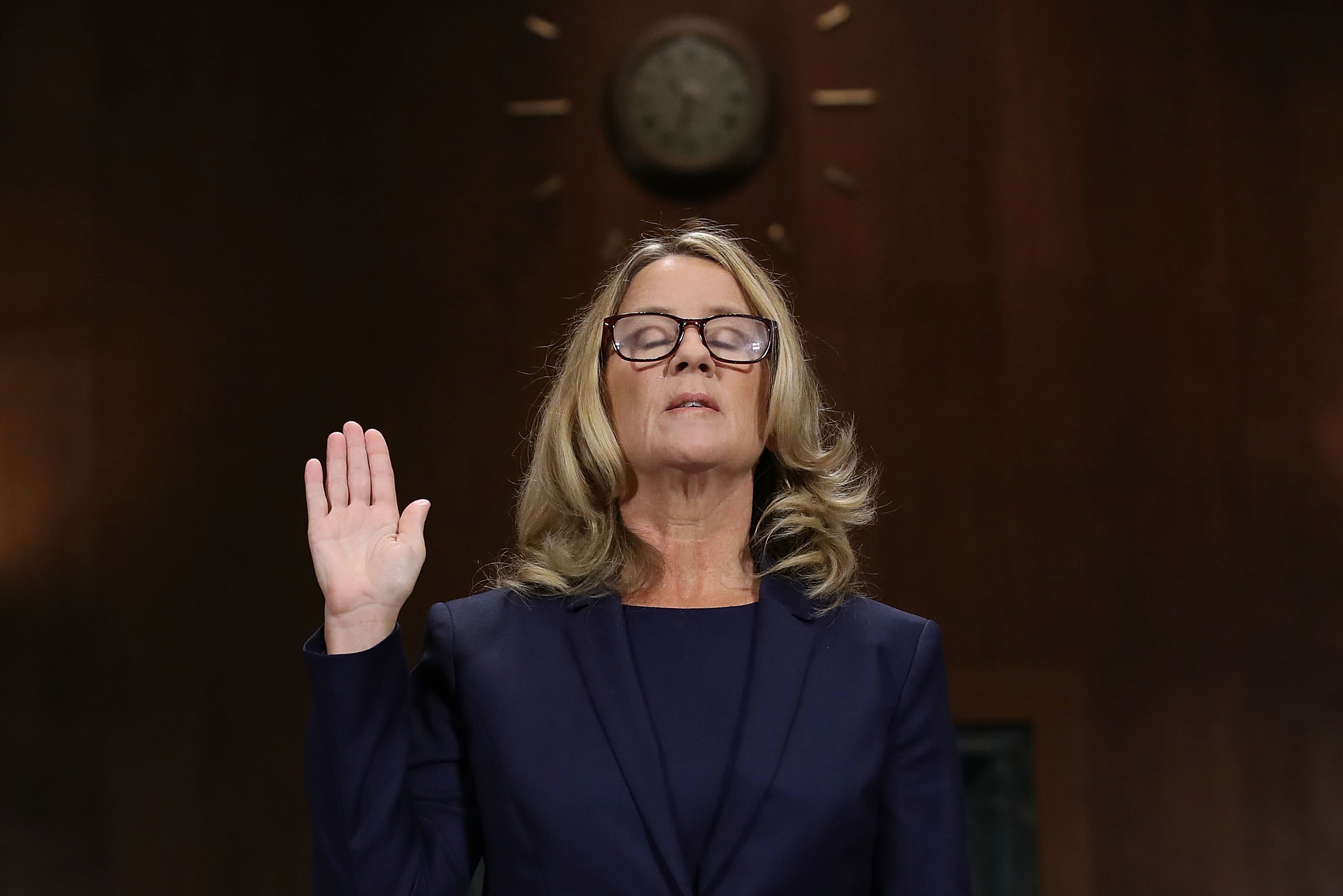 Christine Blasey Ford is sworn in before testifying to the Senate Judiciary Committee on Capitol Hill in Washington on Sept. 27. (Win McNamee—Getty Images)