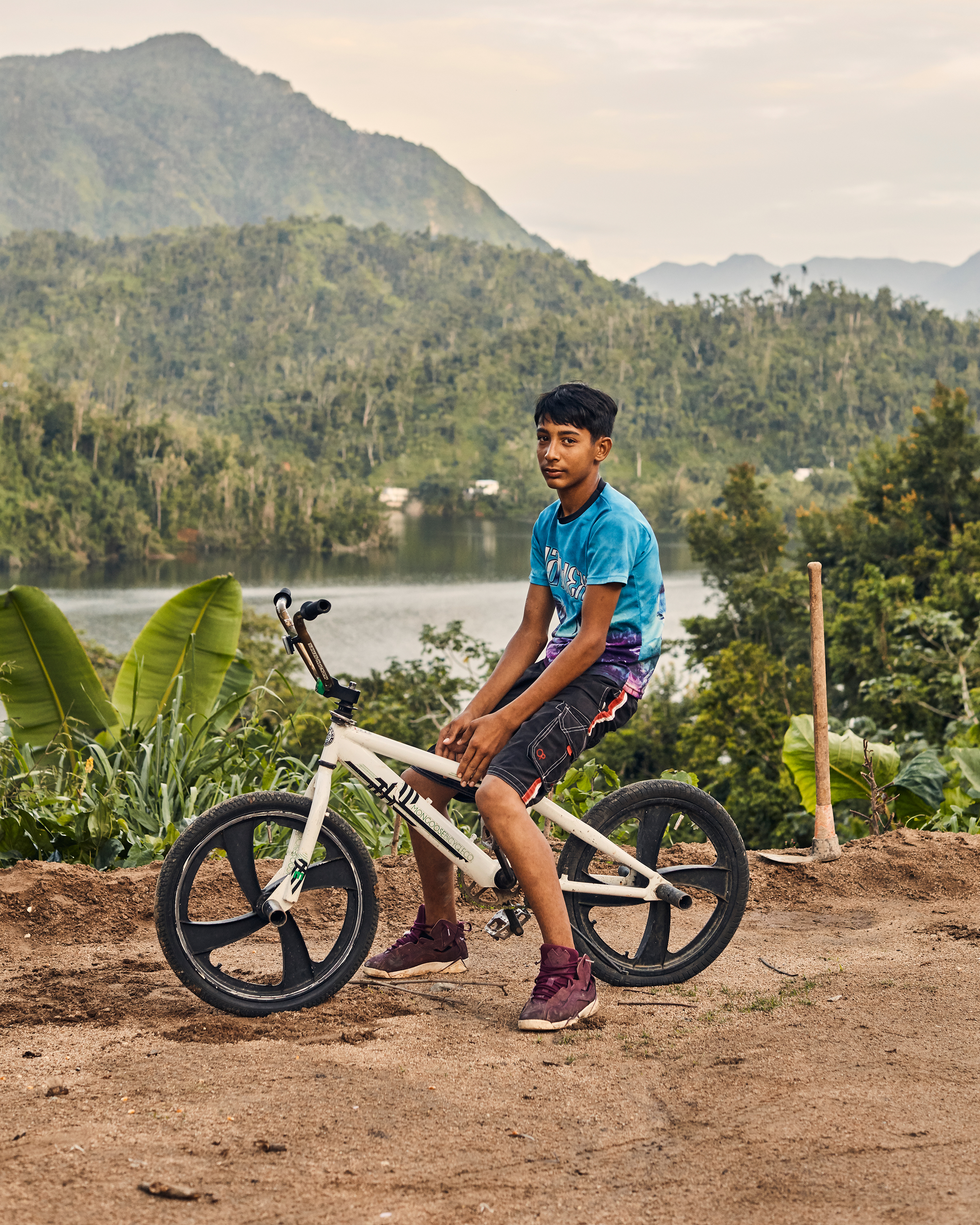 Kaleb Acevedo poses on the bicycle he got after the storm. (Christopher Gregory for TIME)