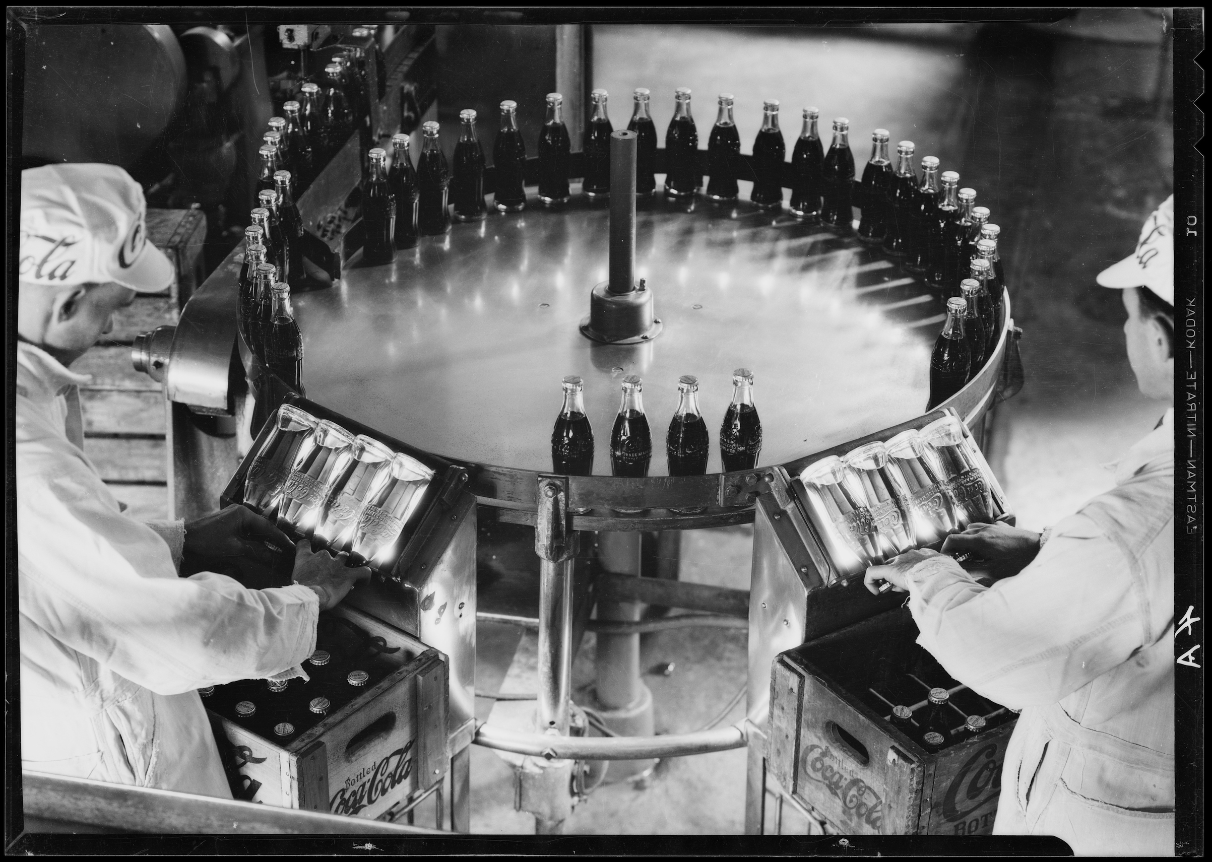 Men inspect bottles on the assembly line at a Coca Cola plant in Los Angeles in the 1930s (University of Southern California/Corbis/Getty Images)