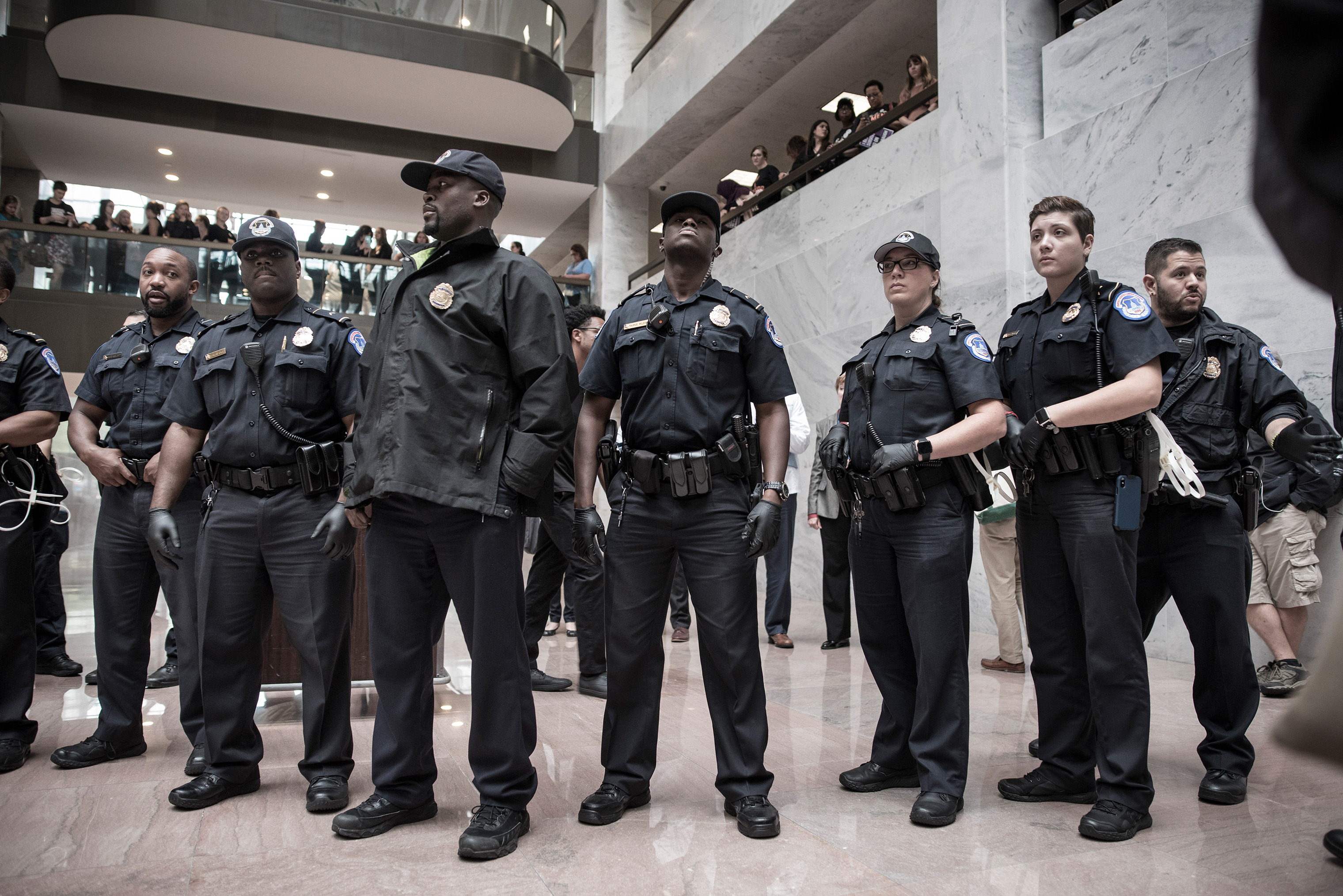 Police gathered to oversee protesters on the ground floor of the Hart Senate Office Building, which is near where the hearing will take place. (David Butow—Redux for TIME)