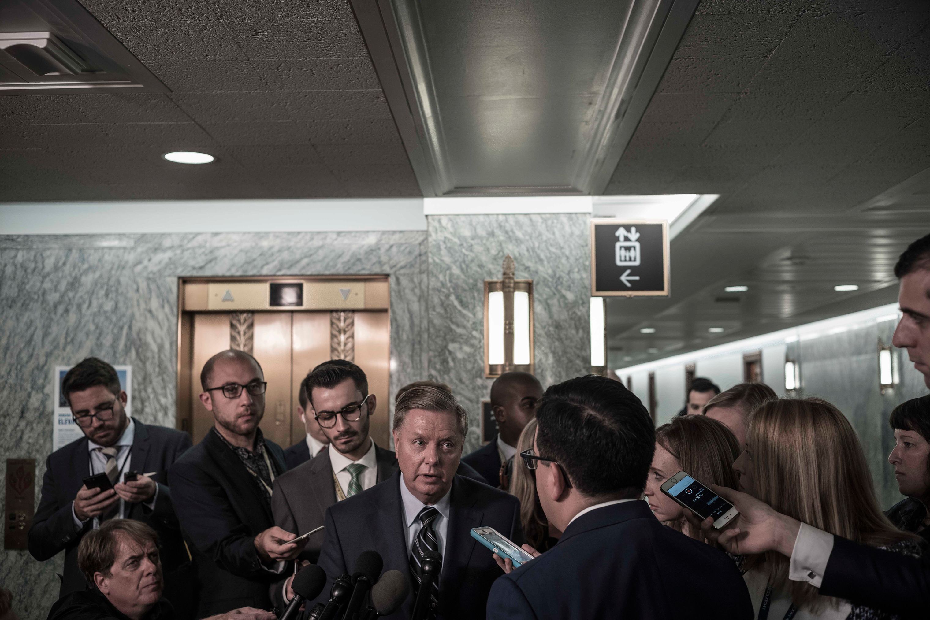 Sen. Lindsey Graham speaks with reporters after the testimony of Christine Blasey Ford on Capitol Hill on Sept. 27. (David Butow—Redux for TIME)