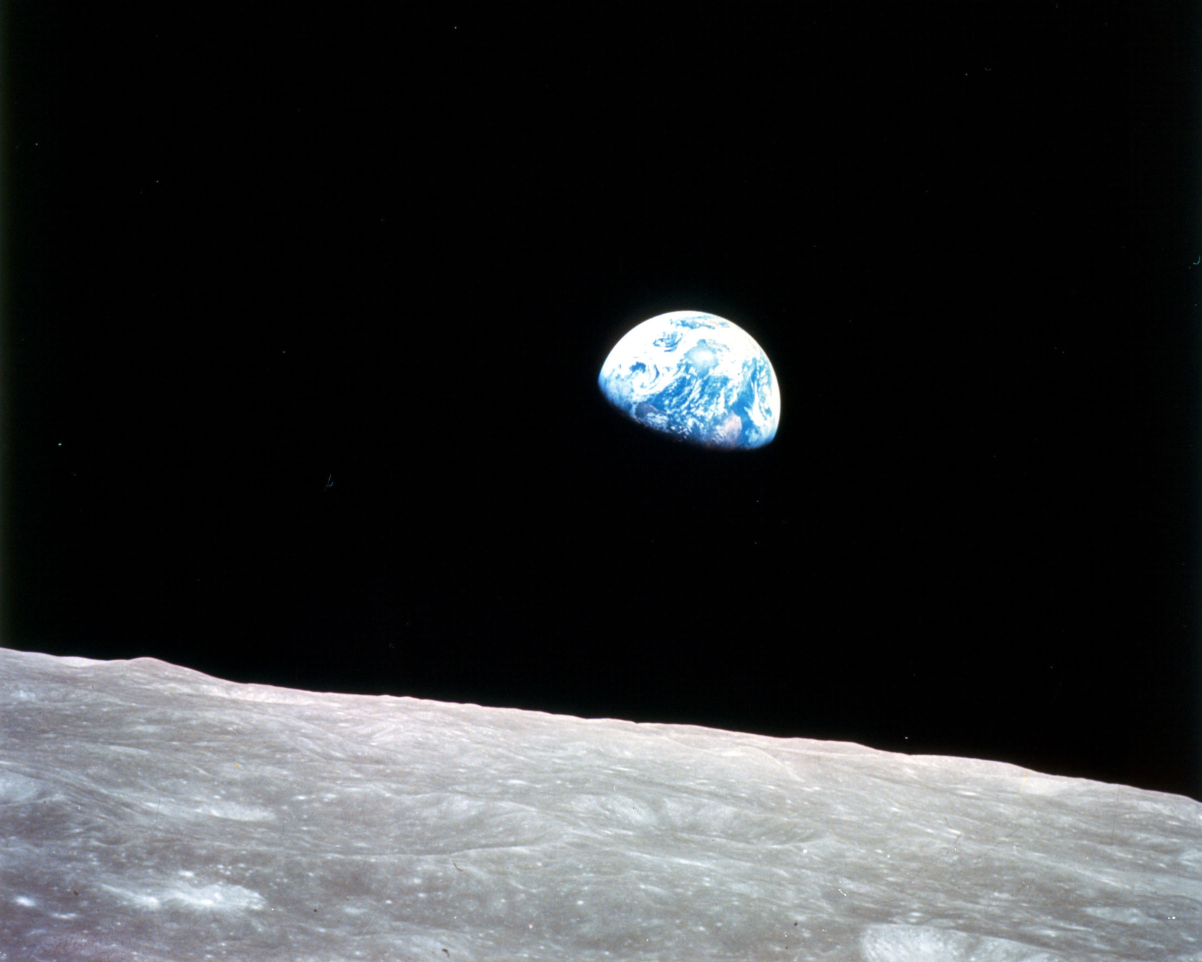 This view of the rising Earth greeted the Apollo 8 astronauts as they came from behind the Moon after the lunar orbit insertion burn. (Science & Society Picture Library / Getty Images)