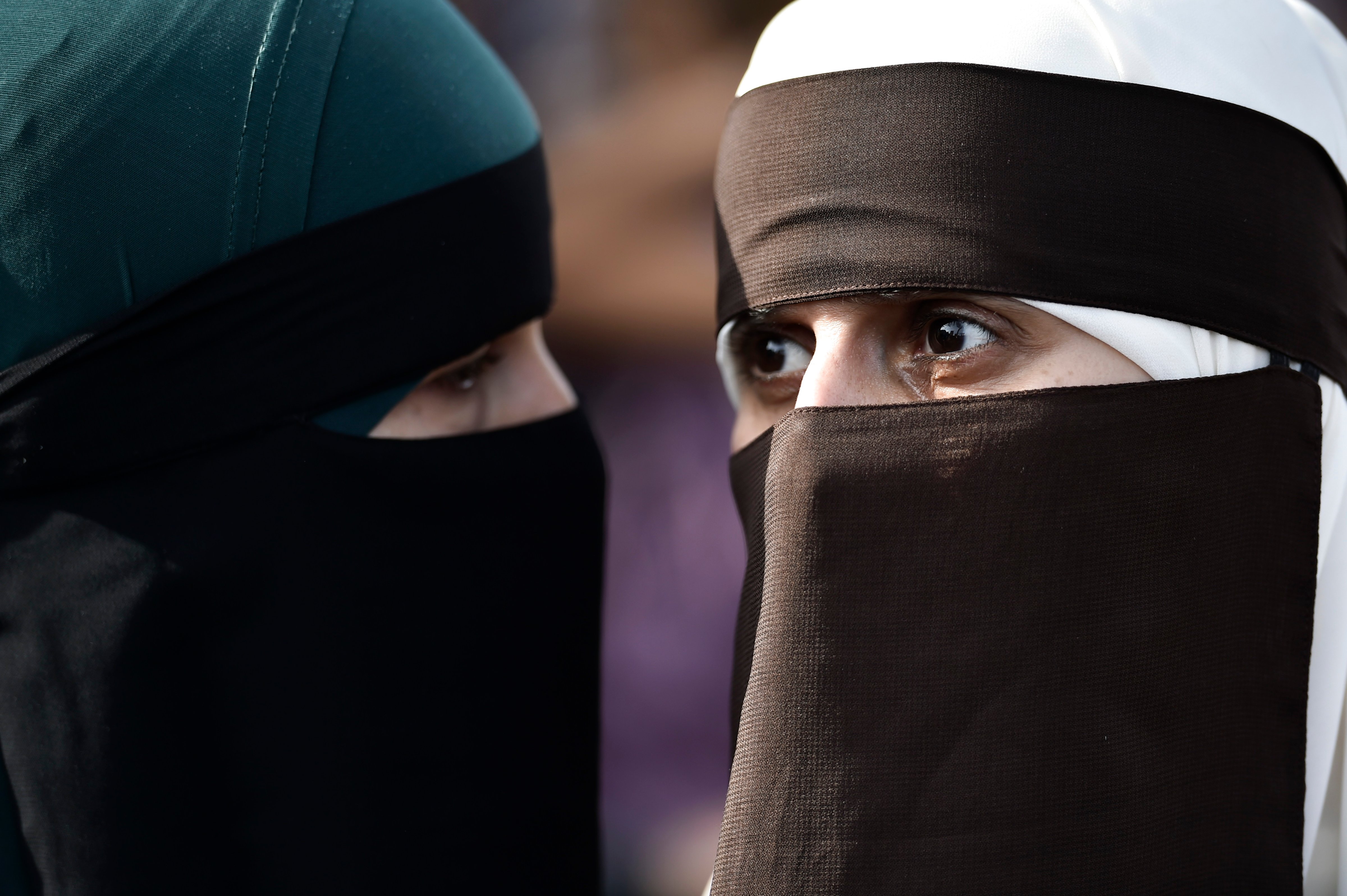 Women wearing niqab to veil their faces take part in a demonstration on August 1, 2018, the first day of the implementation of the Danish face veil ban, in Copenhagen, Denmark. (MADS CLAUS RASMUSSEN—AFP/Getty Images)