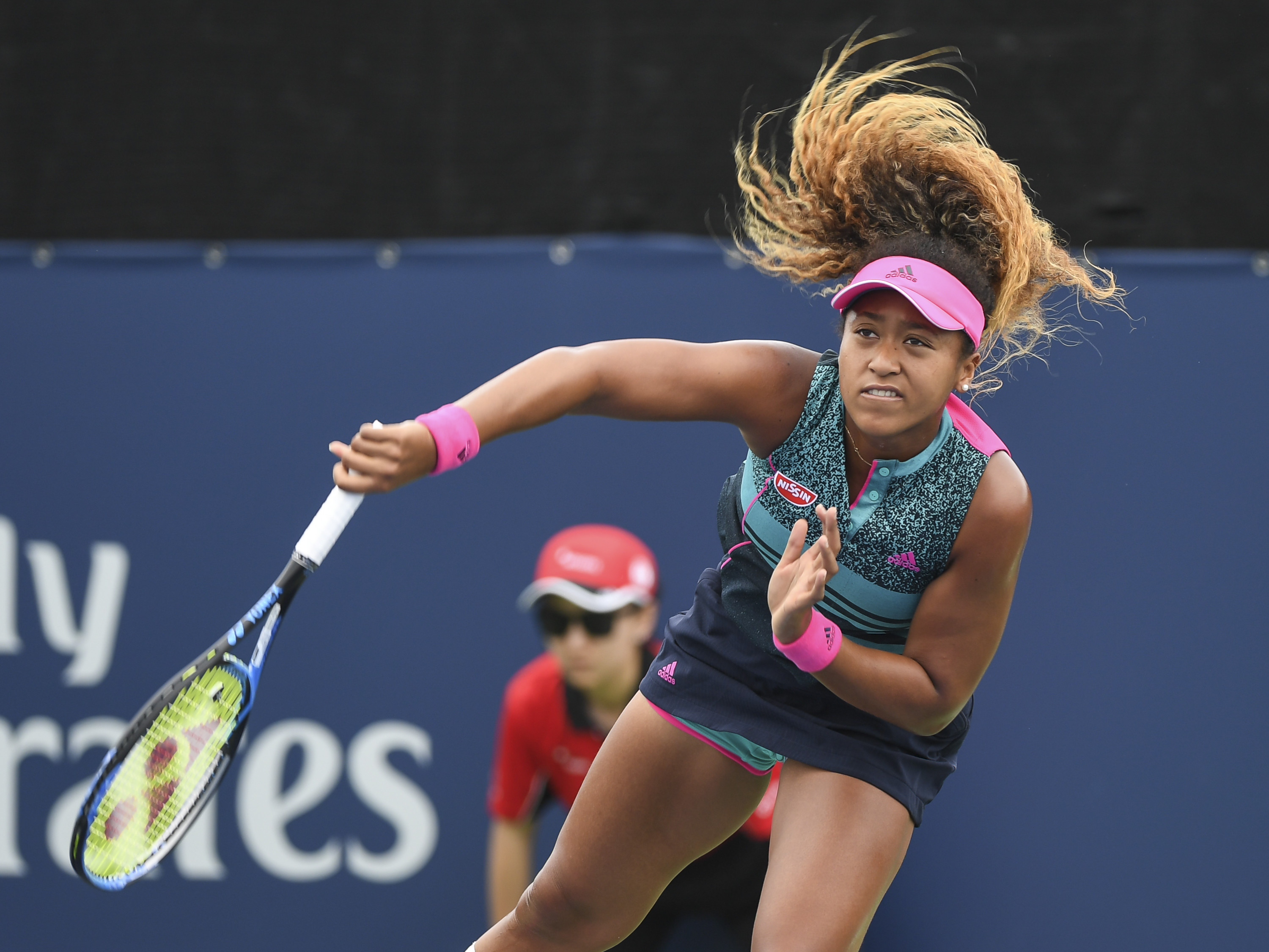 Naomi Osaka of Japan serves during day two of the Rogers Cup at IGA Stadium on Aug. 7, 2018 in Montreal, Quebec. (Minas Panagiotakis—Getty Images)