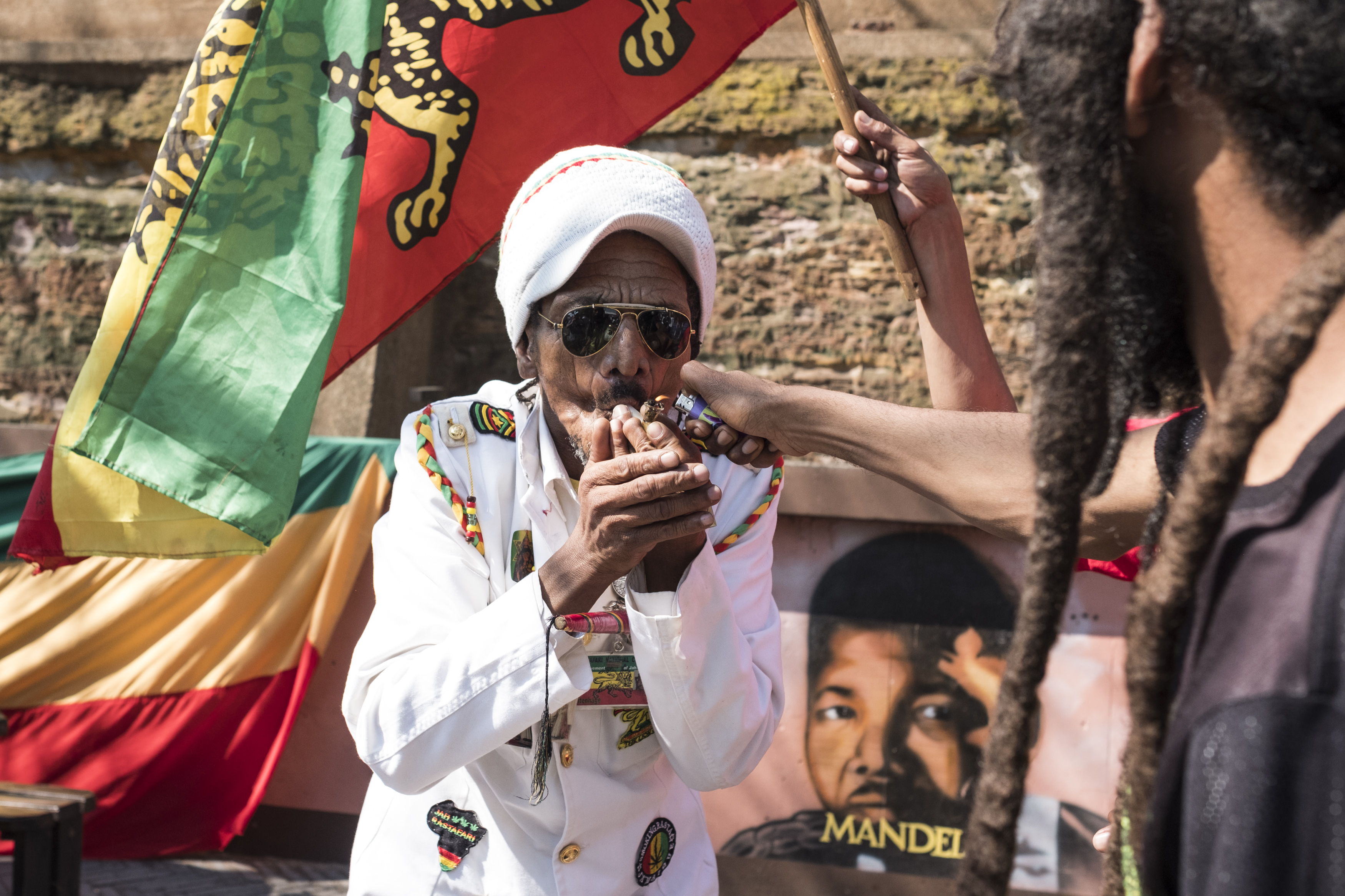 A man smokes marijuana outside the Constitutional Court in Johannesburg on Sept. 18, 2018. (Wikus De Wet—AFP/Getty Images)