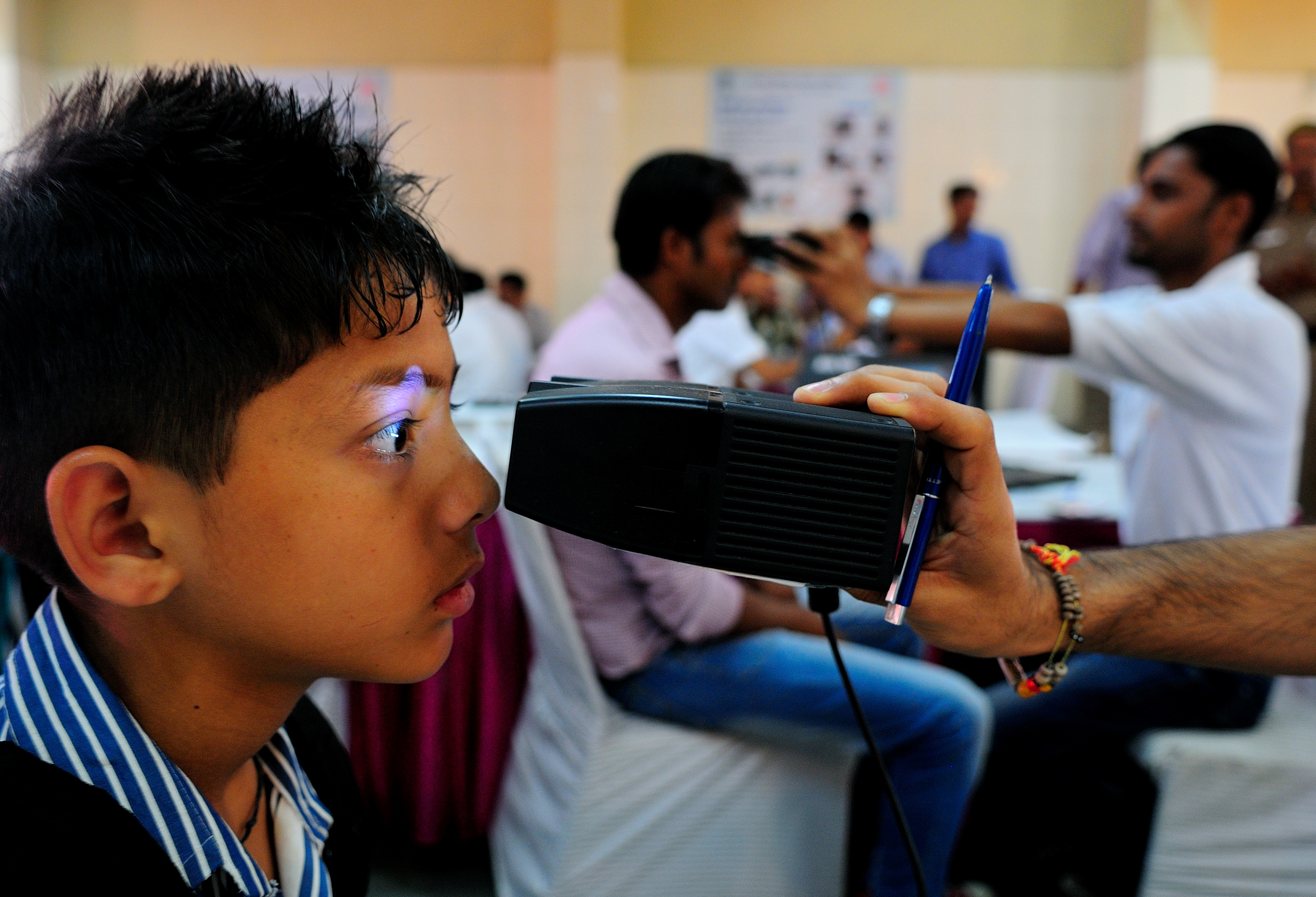 APRIL 12, 2013: A young boy has his iris scanned for an Aadhaar card, New Delhi (Mint&mdash;Hindustan Times via Getty Images)