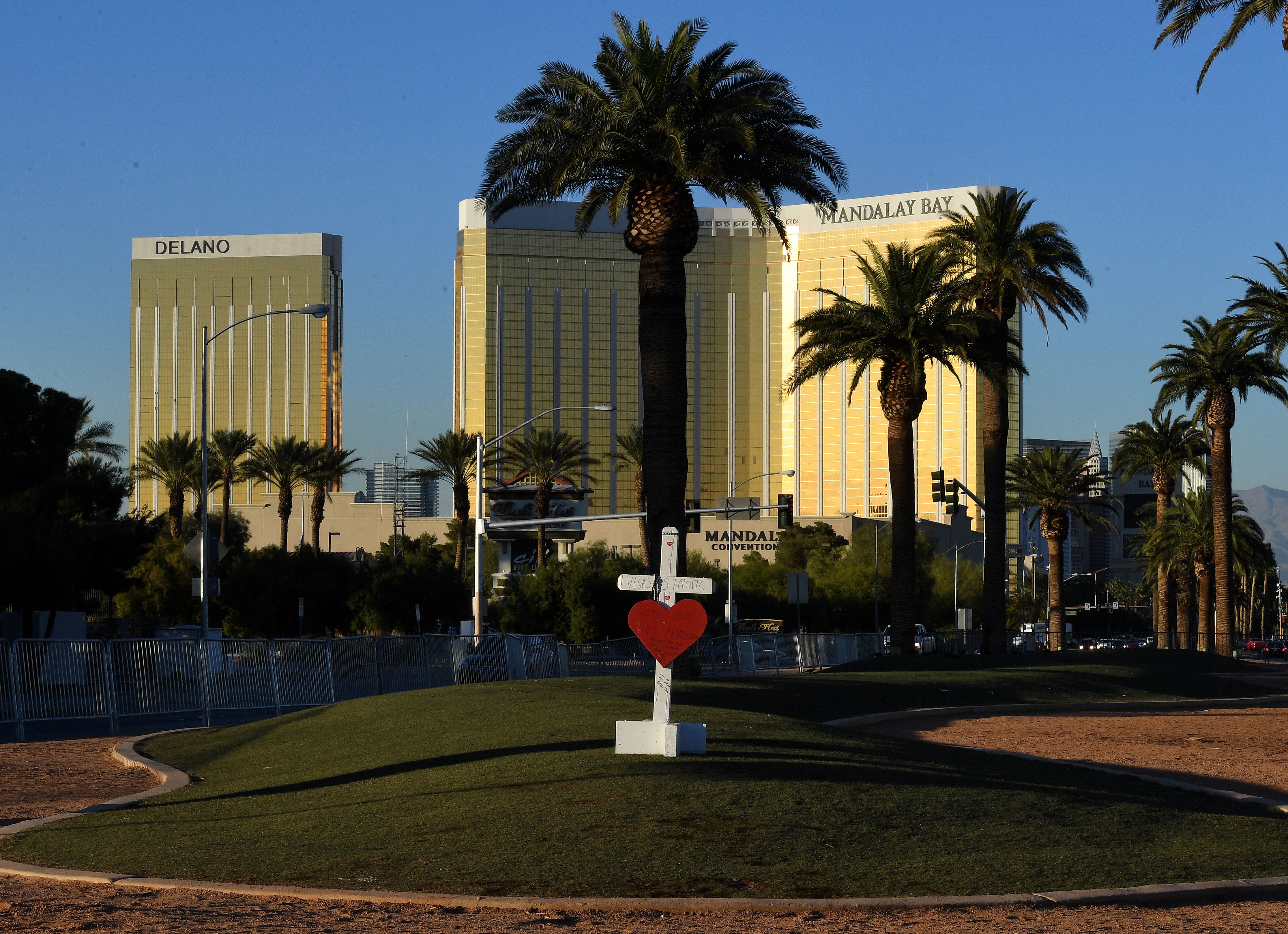 A solitary cross marks a memorial site in front of the Mandalay Hotel where 58 people were killed in Las Vegas, Nevada on Oct. 1, 2017. (Mark Ralston&mdash;AFP/Getty Images)