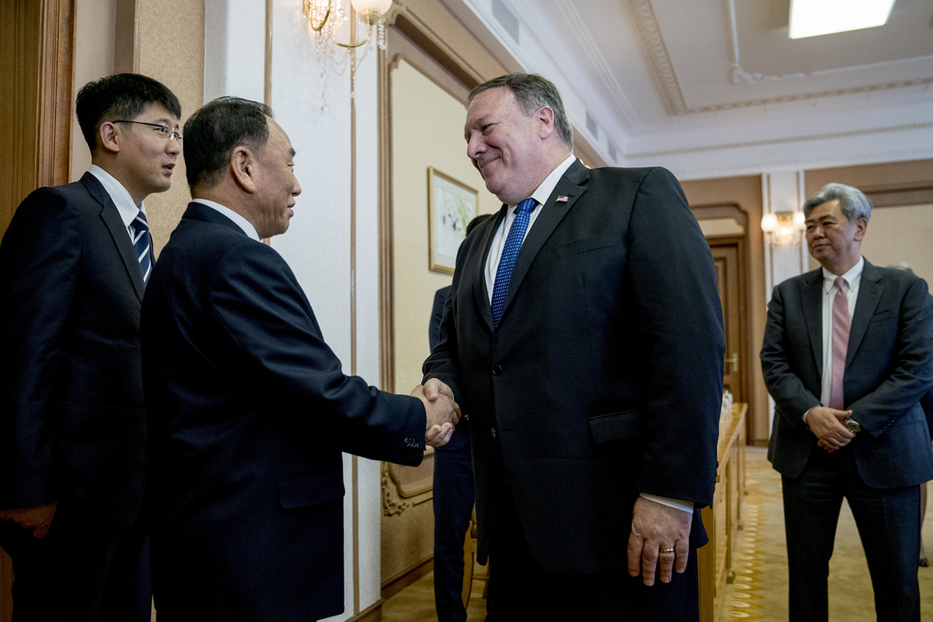 Secretary of State Mike Pompeo greets North Korea's director of the United Front Department, Kim Yong Chol (2nd L) at the Park Hwa Guest House in Pyongyang, North Korea on July 6, 2018. (Andrew Harnik—AFP/Getty Images)