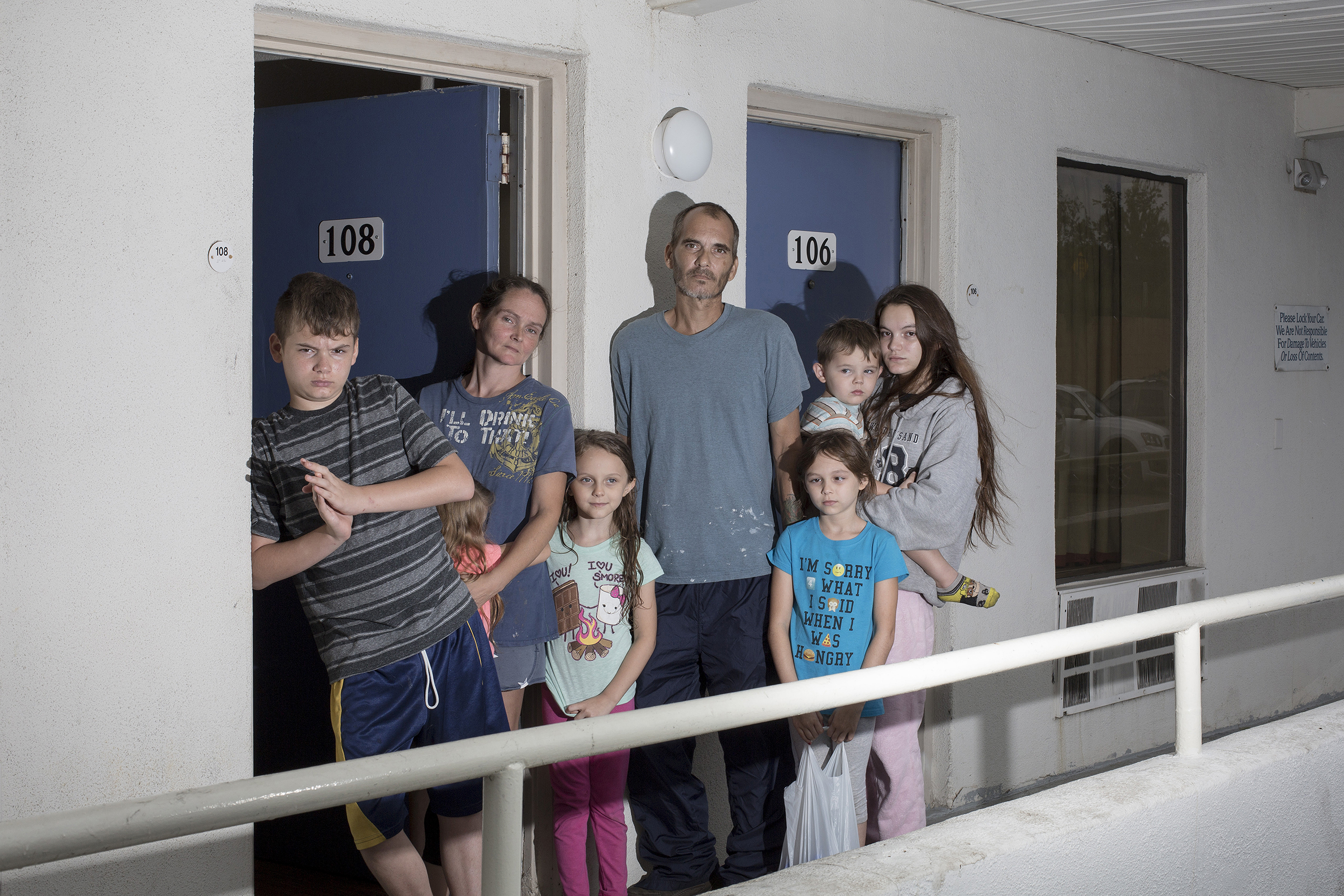 The Brown family from Jacksonville, N.C., poses for a portrait at a motel after fleeing Hurricane Florence in Cary, N.C. on Sept. 14. (Bryan Anselm—Redux for TIME)
