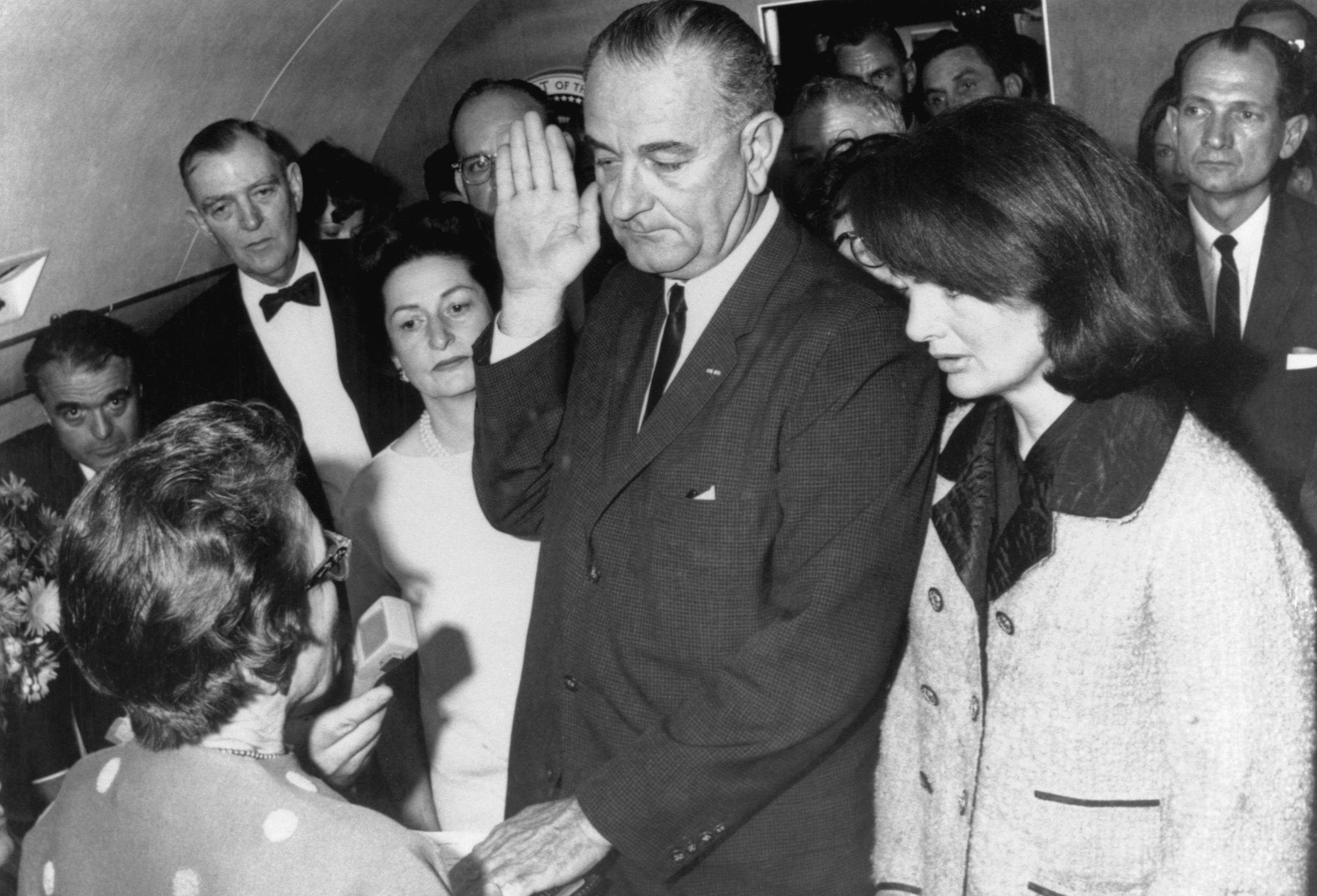 Vice President Lyndon B. Johnson is sworn in to the office of the Presidency aboard Air Force One in Dallas, Texas, hours after the assassination of President John F. Kennedy. (Bettmann/Getty Images)