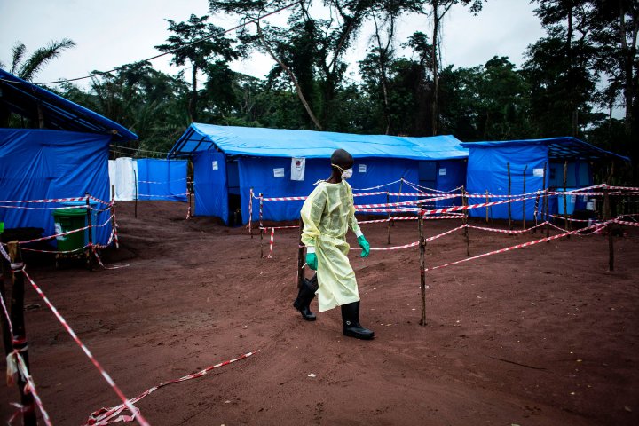 A health worker walks at an Ebola quarantine unit on June 13, 2017 in Muma, after a case of Ebola was confirmed in the village.