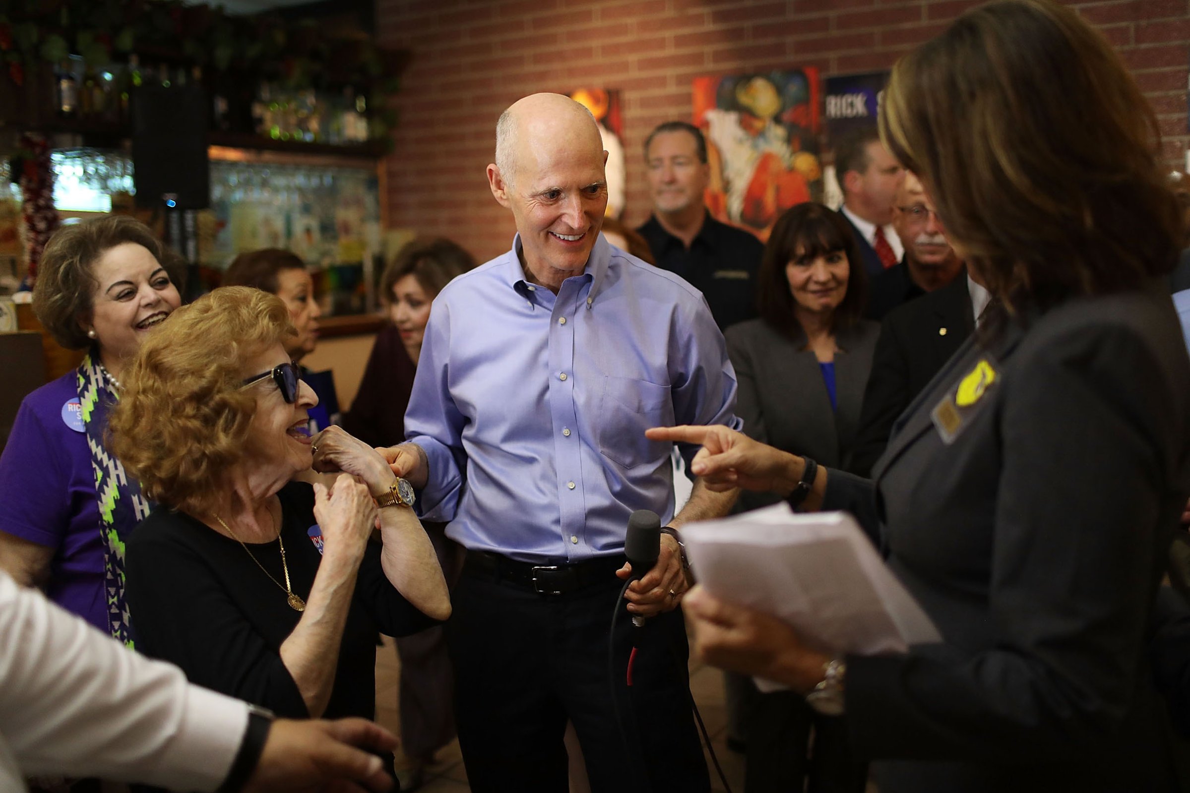 Scott greets voters on June 14 during a campaign stop at Chico’s Restaurant in Hialeah, Fla.