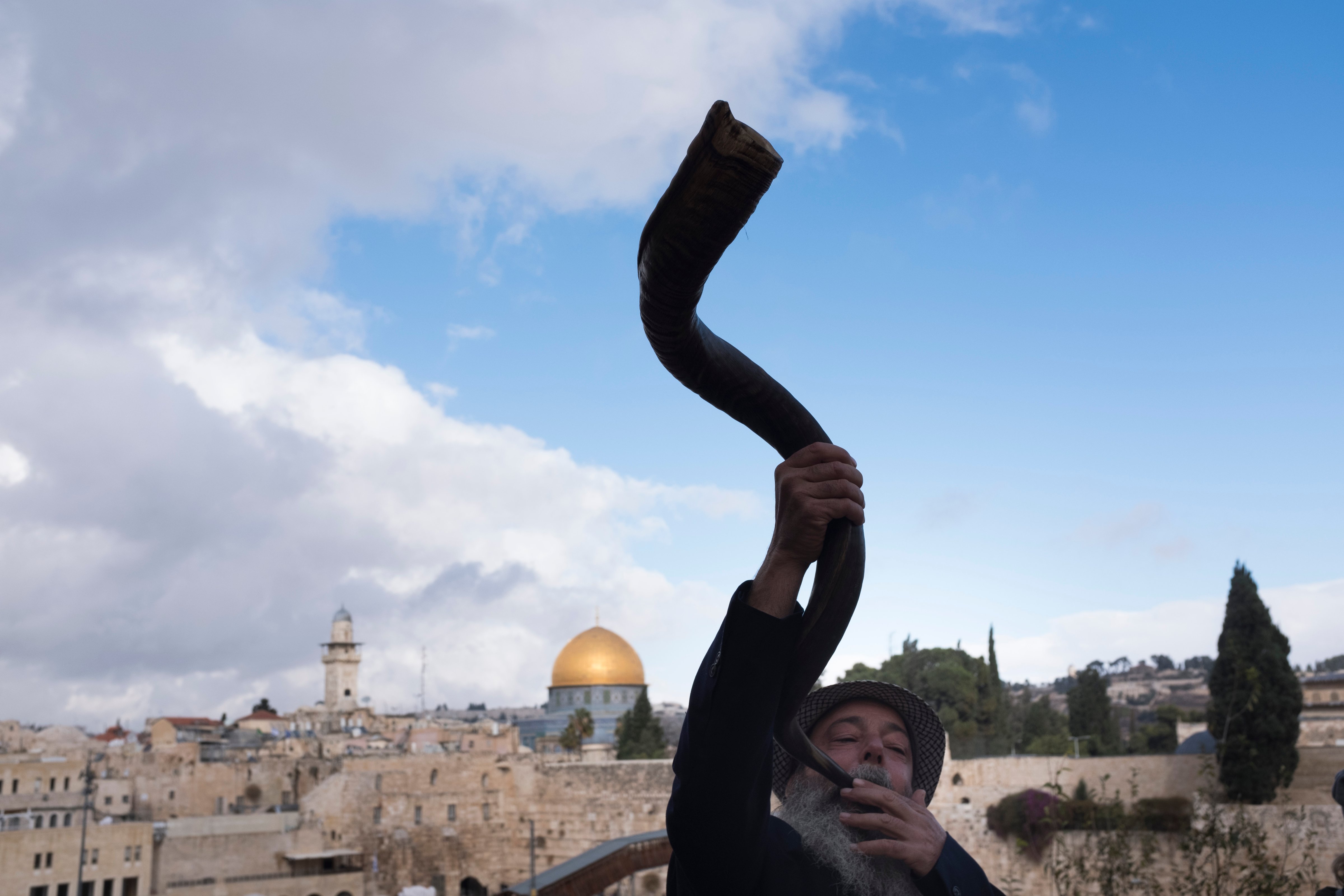 A man blows the shofar (ram's horn.) (Lior Mizrahi—Getty Images)