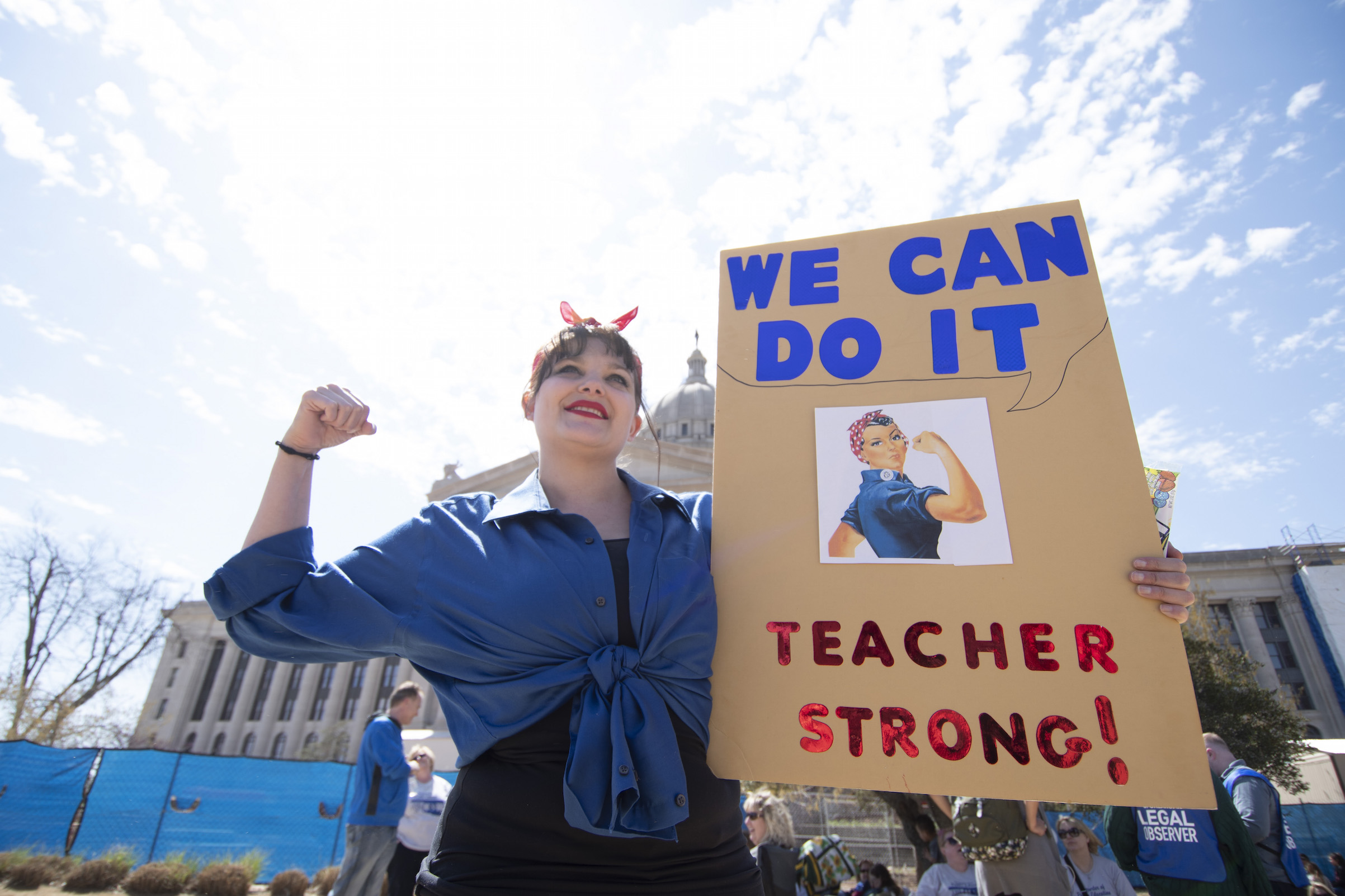Janelle Cox walks the picket line at the state capitol on April 9, 2018 in Oklahoma City. Thousands of teachers and supporters were expected to rally at the state Capitol at that time. (J Pat Carter—Getty Images)