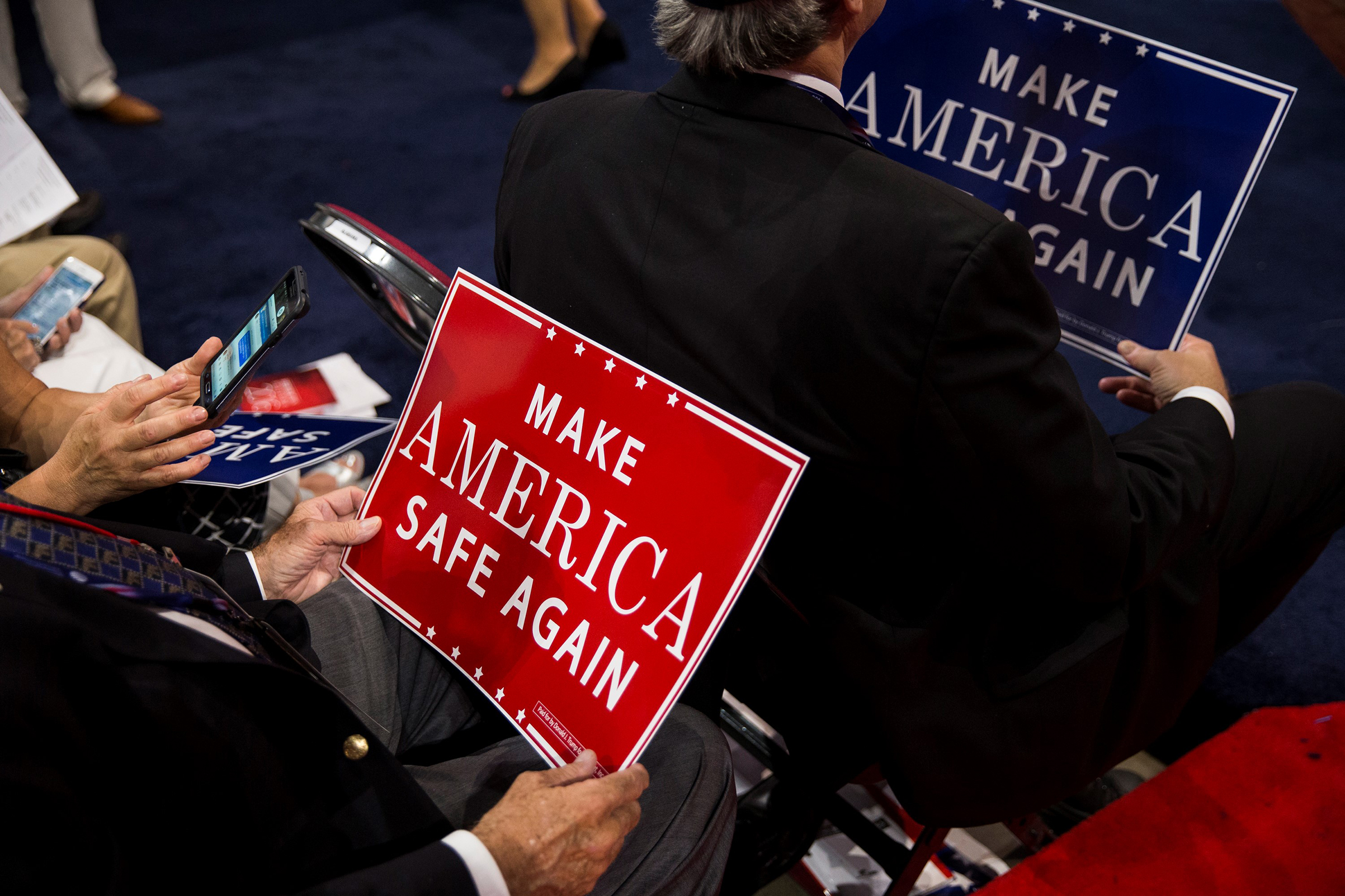 Delegates hold signs that say "Make America Safe Again", the new GOP slogan, during the 2016 Republican National Convention in Cleveland, Ohio, on July 18, 2016. (Samuel Corum—Anadolu Agency/Getty Images)