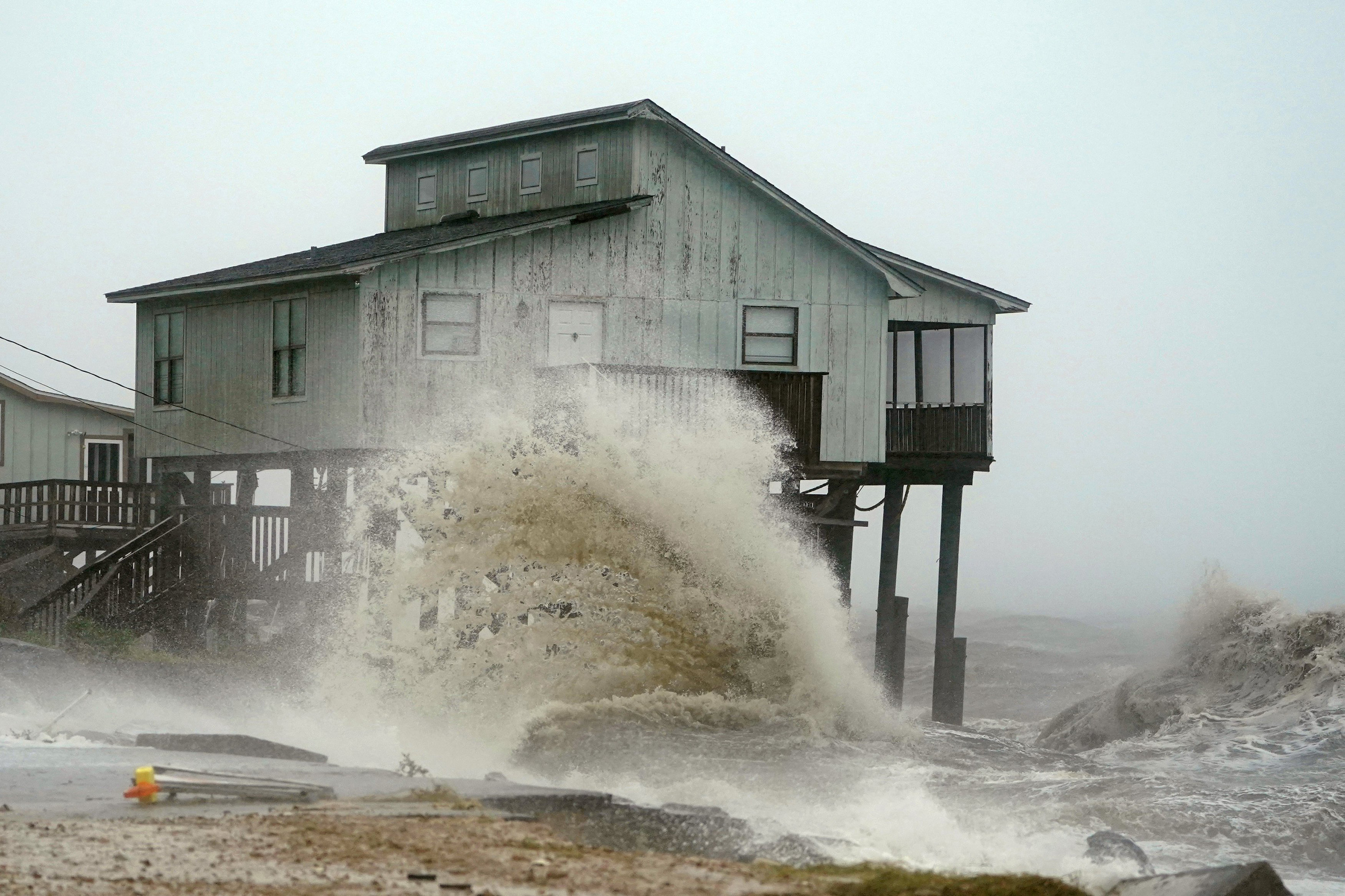 Waves take over a house as Hurricane Michael comes ashore in Alligator Point, Fla., Oct. 10, 2018. (Carlo Allegri—Reuters)