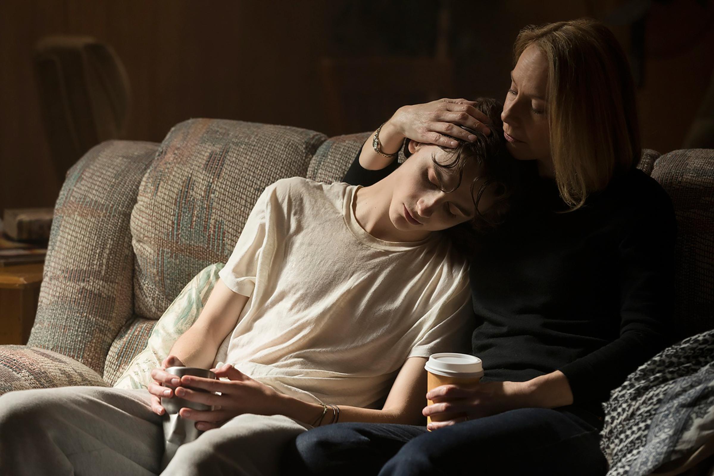 Nic (Timothée Chalamet) is consoled by his mother (Amy Ryan)