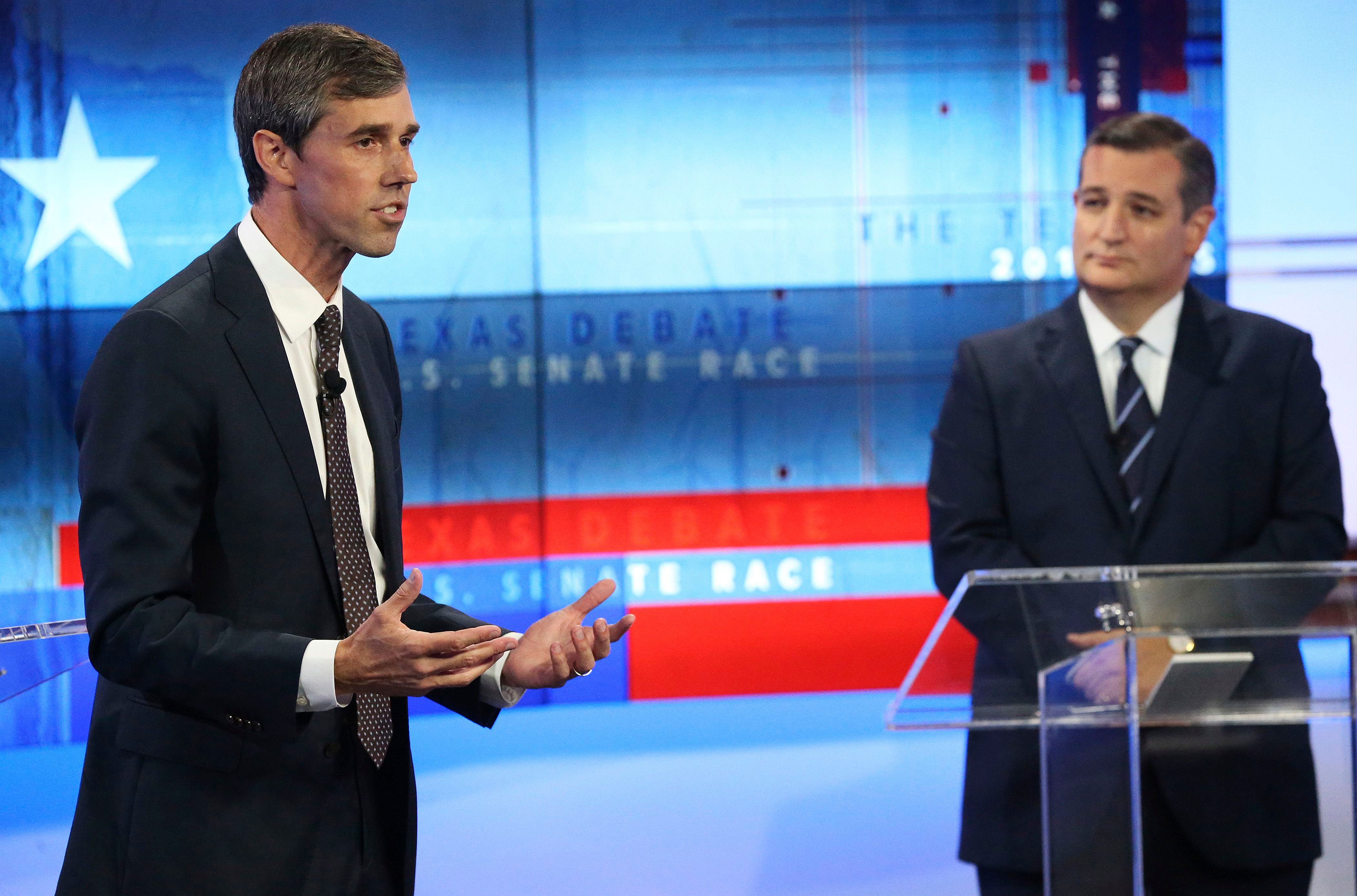 Republican Senator Ted Cruz of Texas (R) listens as Democratic challenger and US Representative from Texas Beto O'Rourke (L) gives his final remarks during a debate before the US Midterm elections in San Antonio, Texas, on Oct. 16, 2018. (TOM REEL—POOL/EPA-EFE/REX/Shutterstock)