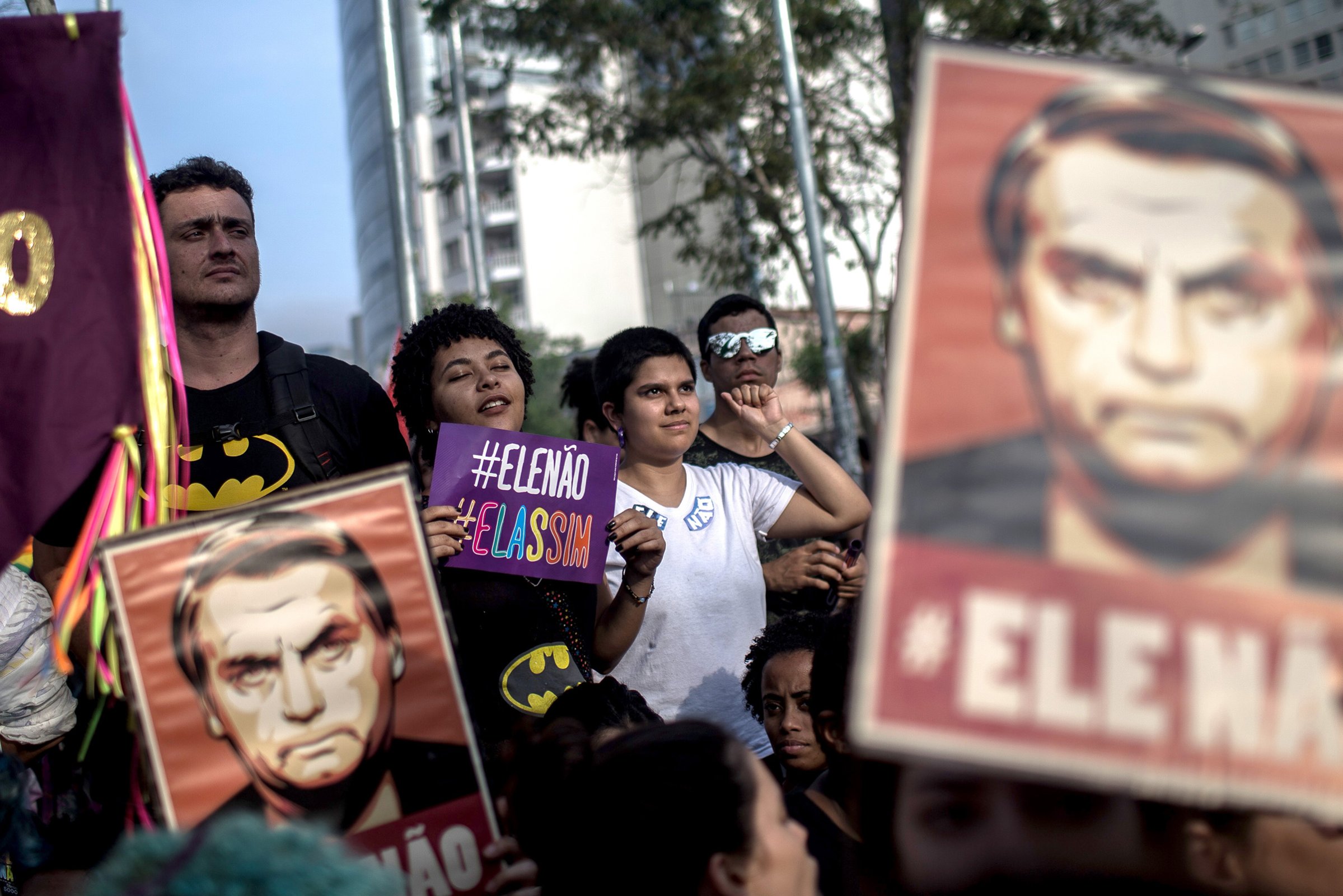 Protesters carry posters against the far-right’s presidential candidate Jair Bolsonaro in Sao Paulo, Brazil on Sept. 29, 2018.