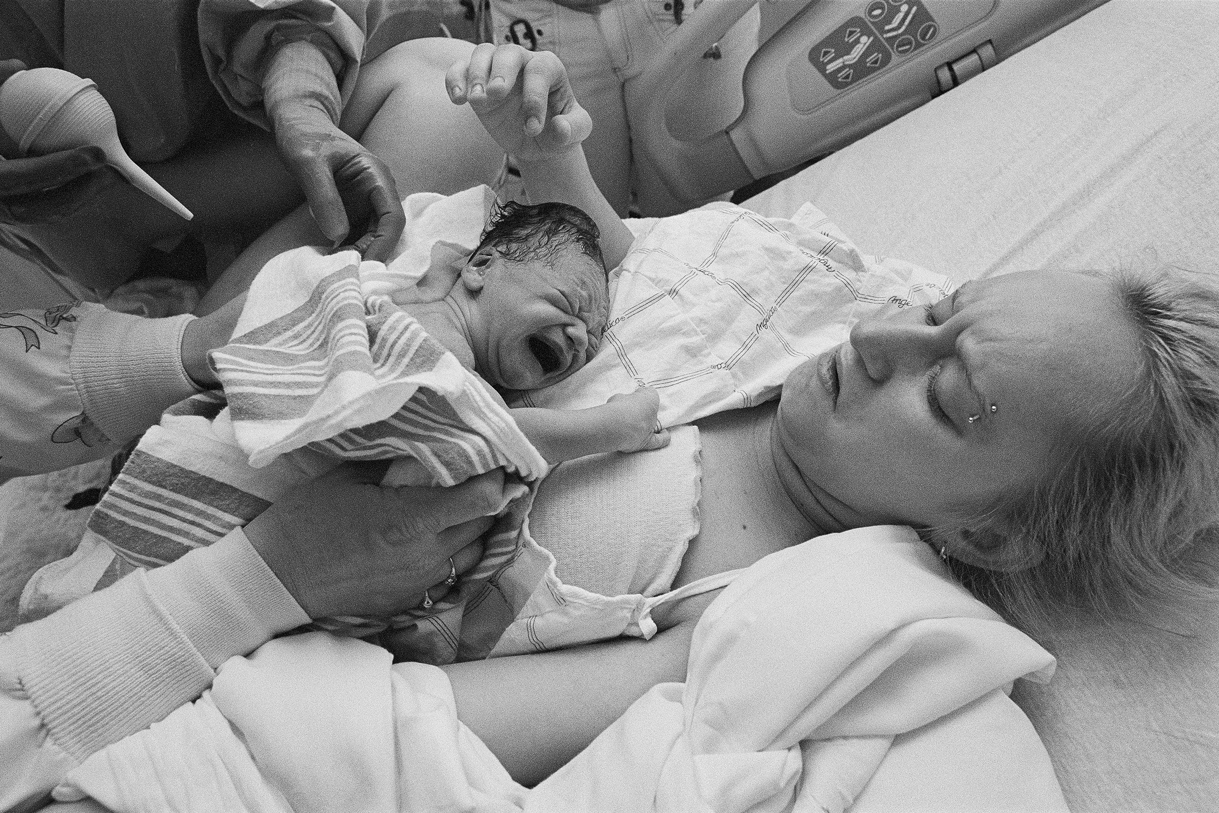 Kayla Stocklas, 14 years old, giving birth to her son Tony in Troy, N.Y., on April 18, 2004. "He was named after her girlfriend Sabrina's father," says Kenneally, "who was serving a nineteen-year prison sentence." (Brenda Ann Kenneally)