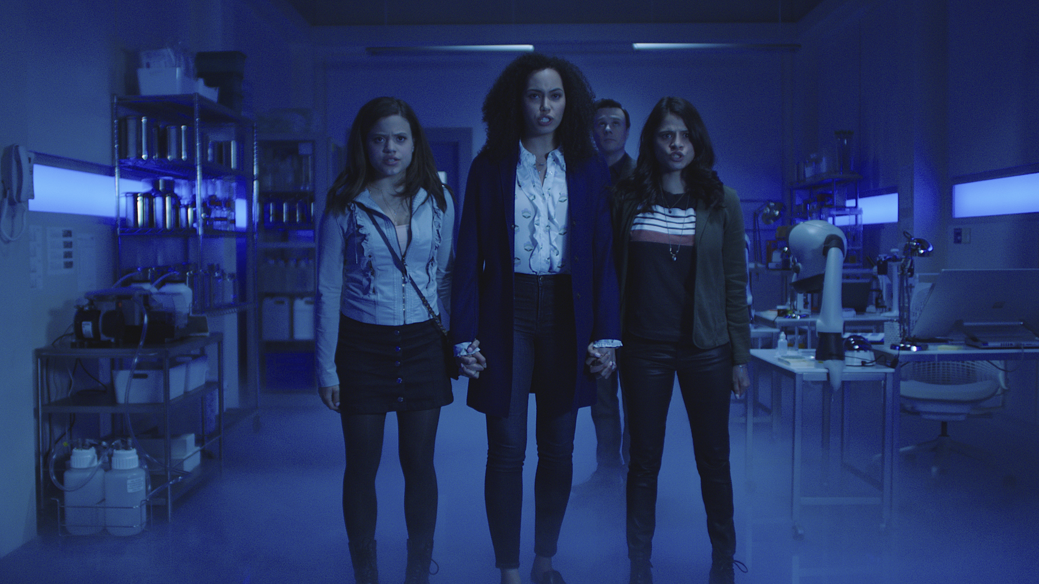 Screen grab from the pilot episode of Charmed. Pictured (L-R): Sarah Jeffery as Maggie Vera, Madeleine Mantock as Macy Vaughn, Rupert Evans as Harry Greenwood and Melonie Diaz as Mel Vera (The CW)