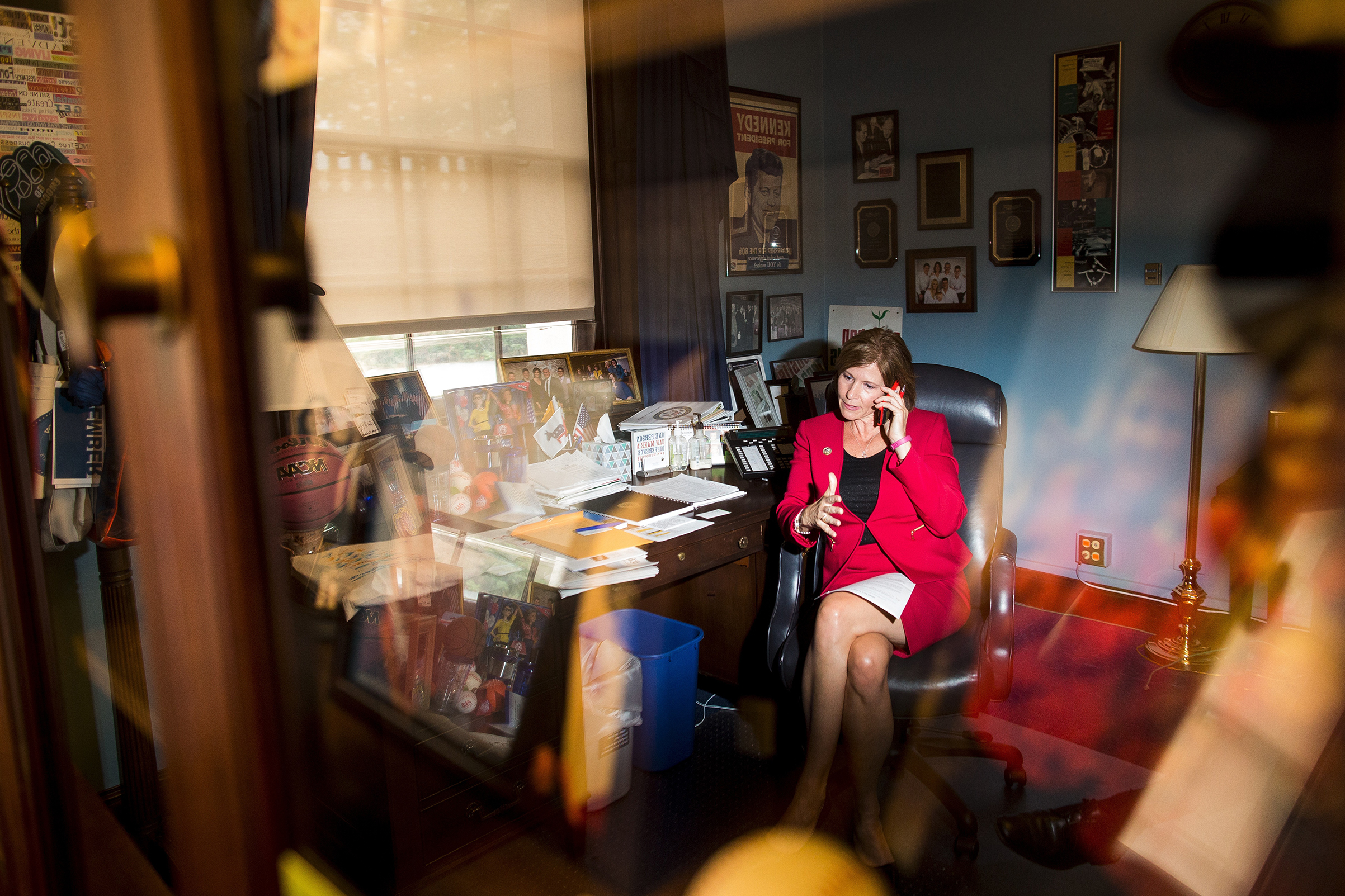 Bustos works the phone at her office on Capitol Hill in May 2017 (M. Scott Mahaskey—Politico)