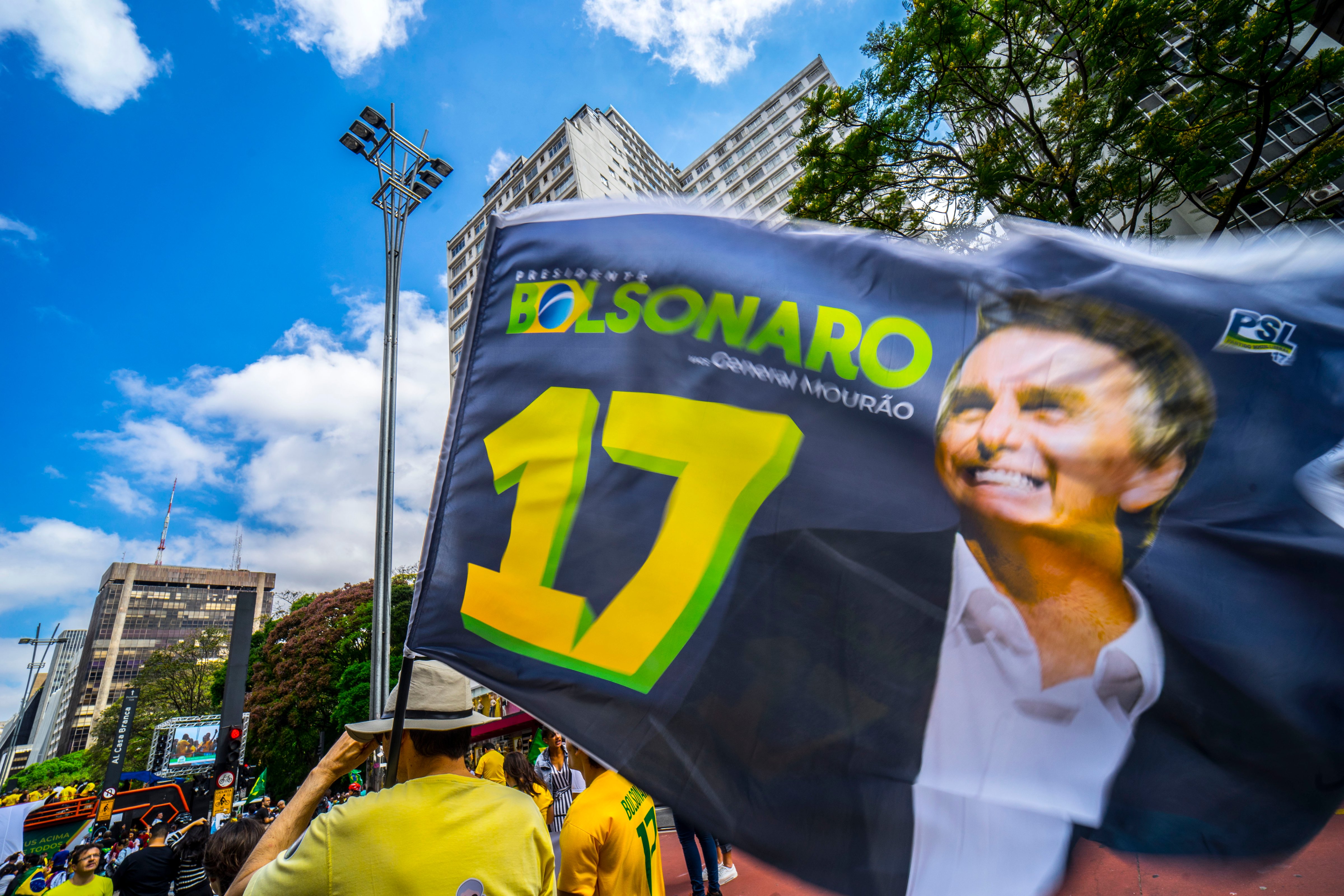 Supporters of Brazilian right-wing presidential candidate Jair Bolsonaro take part in a rally along Paulista Avenue in Sao Paulo Brazil on October 21 2018. - Barring any last-minute upset, Brazil appears poised to elect Jair Bolsonaro, a populist far-right veteran politician, as its next president in a week's time. (NurPhoto/Getty Images)
