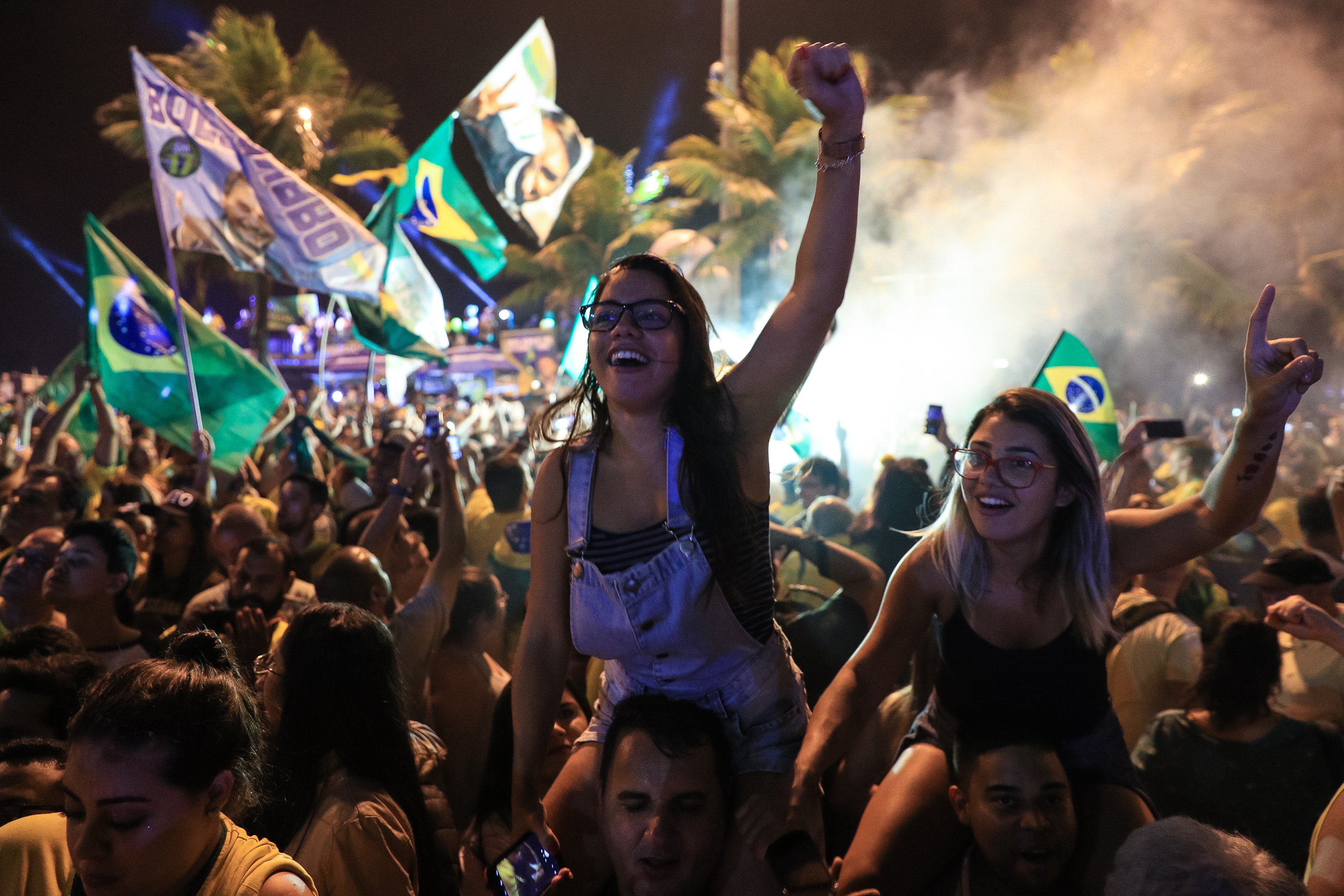 Supporters of far-right presidential candidate Jair Bolsonaro, celebrate in front of his house in Rio de Janeiro, Brazil, after he won Brazil's presidential election, on Oct. 28, 2018 in Rio de Janeiro, Brazil (Buda Mendes—Getty Images)