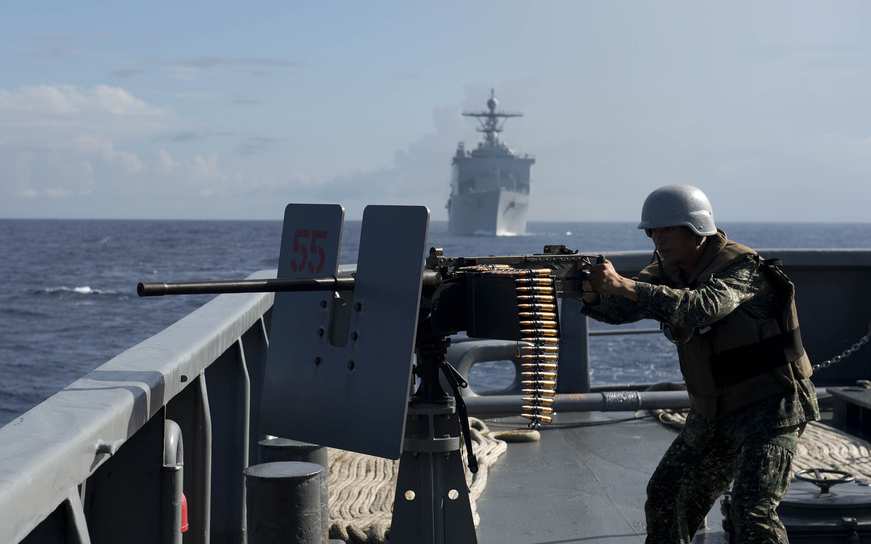A Philippine Navy personnel mans a .50 caliber machine gun during the bilateral maritime exercise between the Philippine Navy and US Navy innear waters claimed by Beijing  the South China Sea on June 29, 2014. (Noel Celis—AFP/Getty Images)