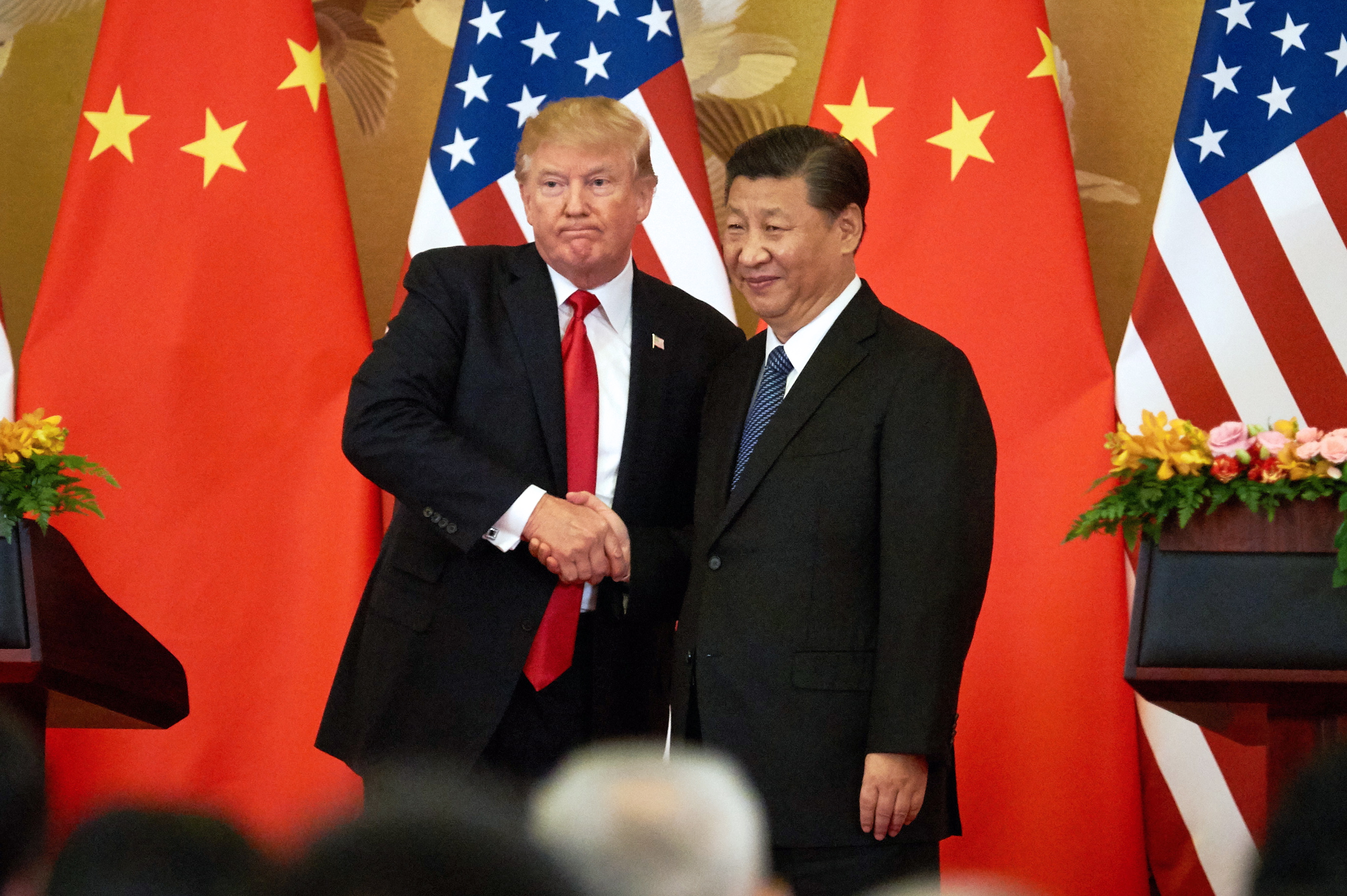 US President Donald Trump (L) and China's President Xi Jinping shake hands at a press conference following their meeting at the Great Hall of the People in Beijing. (Artyom Ivanov&mdash;Artyom Ivanov/TASS)