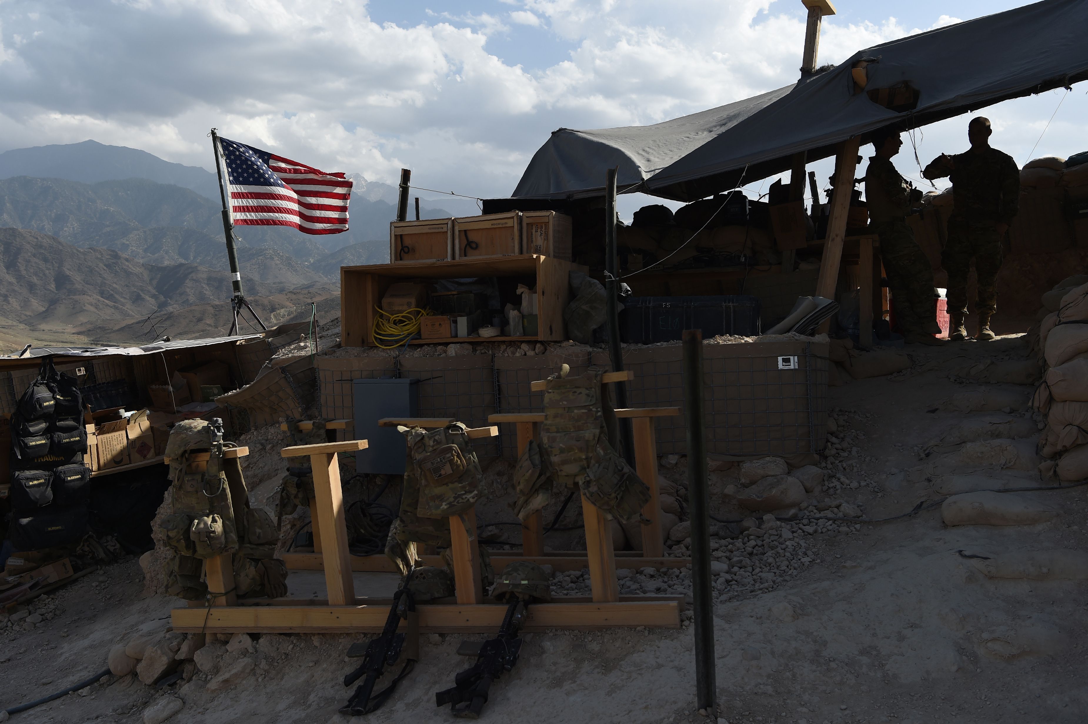 U.S. Army soldiers from NATO look on as the U.S. flag flies at a checkpoint during a patrol against Islamic State militants in Nangarhar Province, Afghanistan on July 7, 2018. (Wakil Kohsar&mdash;AFP/Getty Images)
