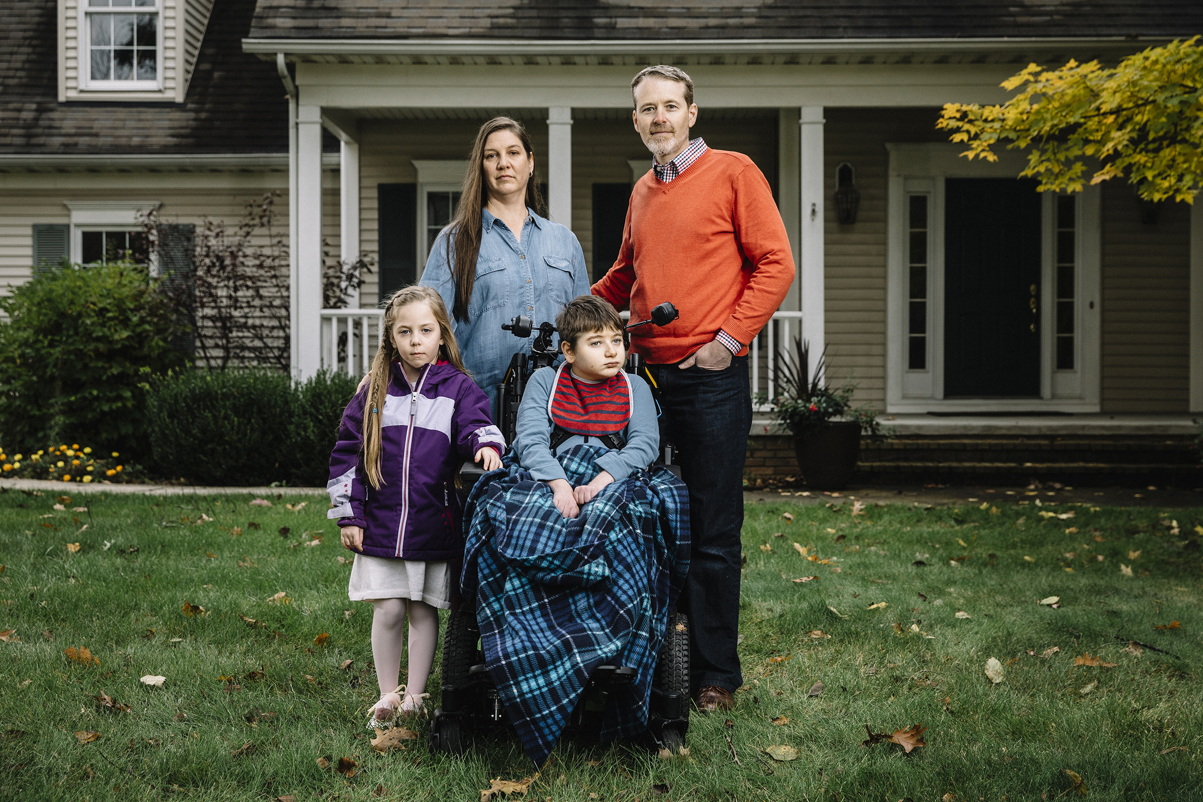 Christine and Larry Callahan, with kids Claire, 5, and Andrew, 11, in front of their home in Cleveland’s northeast suburbs (William Widmer—Redux for TIME)